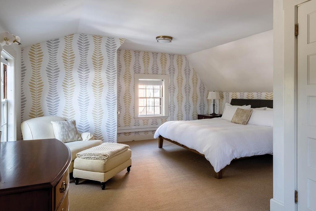 58 Randolph Road Brookline, MA 02467 - Photo 7 of 14 a bedroom with a bed and a couch