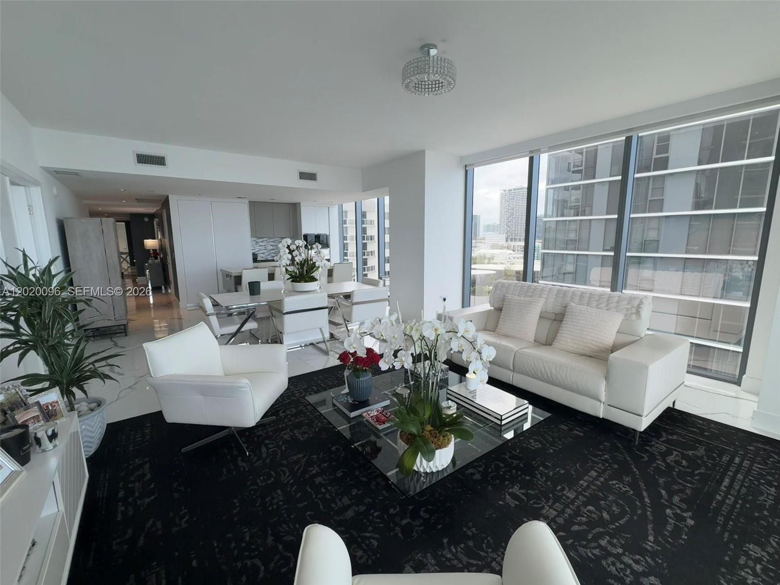 788 Northeast 23rd Street, Unit 1202 Miami, FL 33137 - Photo 9 of 64 a living room with furniture and a large window