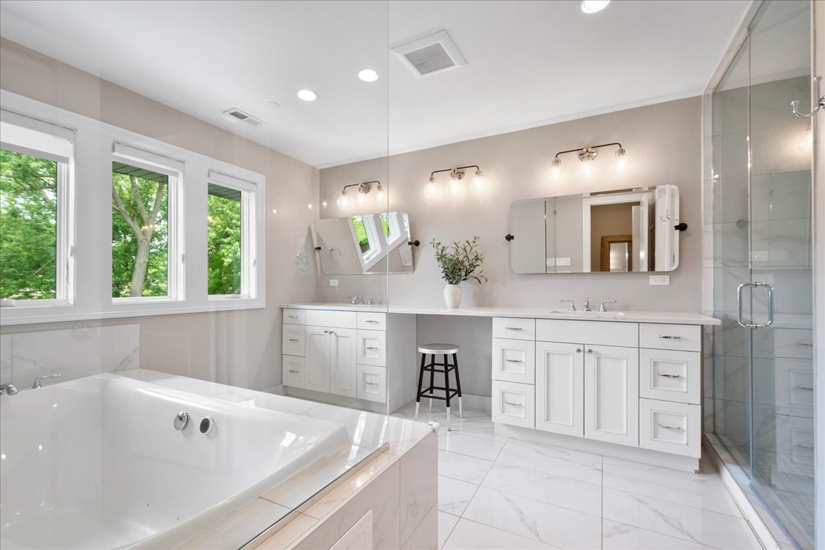 2921 Simpson Street Evanston, IL 60201 - Photo 18 of 41 a spacious bathroom with a granite countertop sink mirror and bathtub
