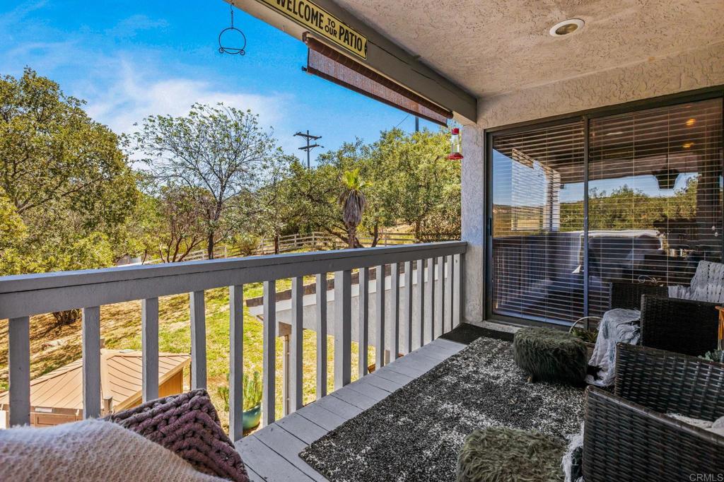 17901 Lyons Valley Road Jamul, CA 91935 - Photo 33 of 52 a view of a porch with furniture and floor to ceiling window