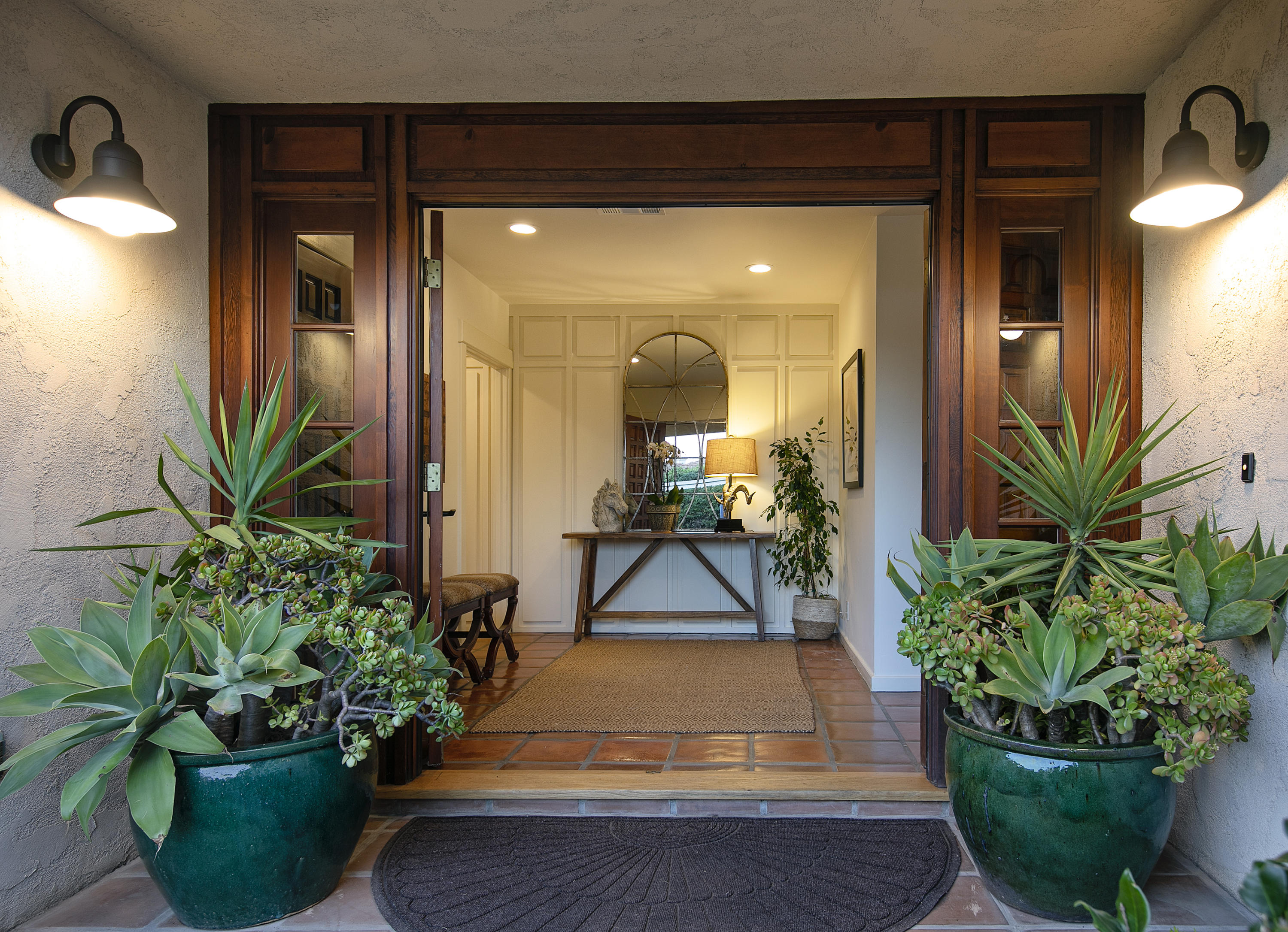1025 Mission Ridge Road Santa Barbara, CA 93103 - Photo 3 of 10 a potted plant sitting in front of a house