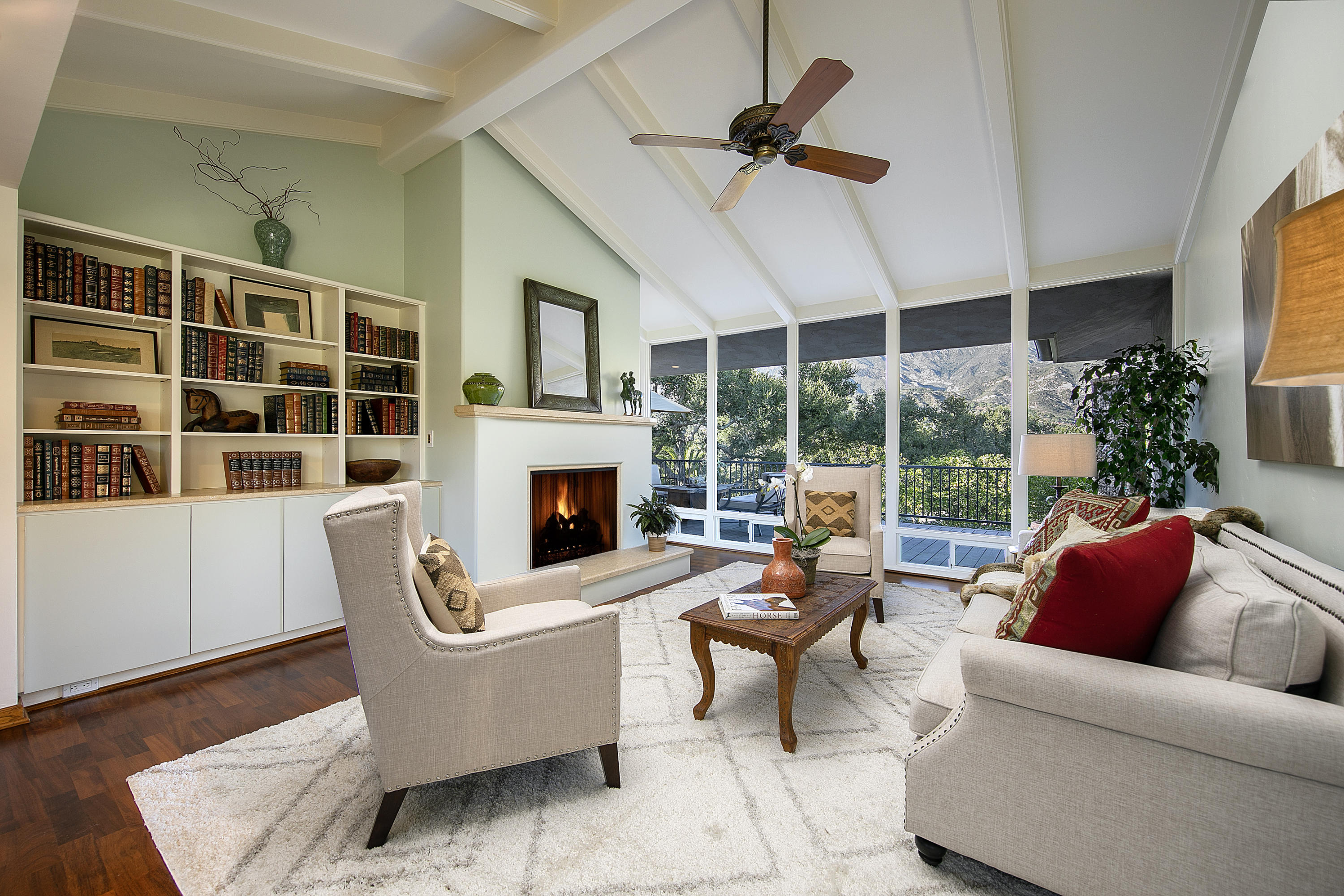 1025 Mission Ridge Road Santa Barbara, CA 93103 - Photo 5 of 10 a living room with furniture fireplace and floor to ceiling window