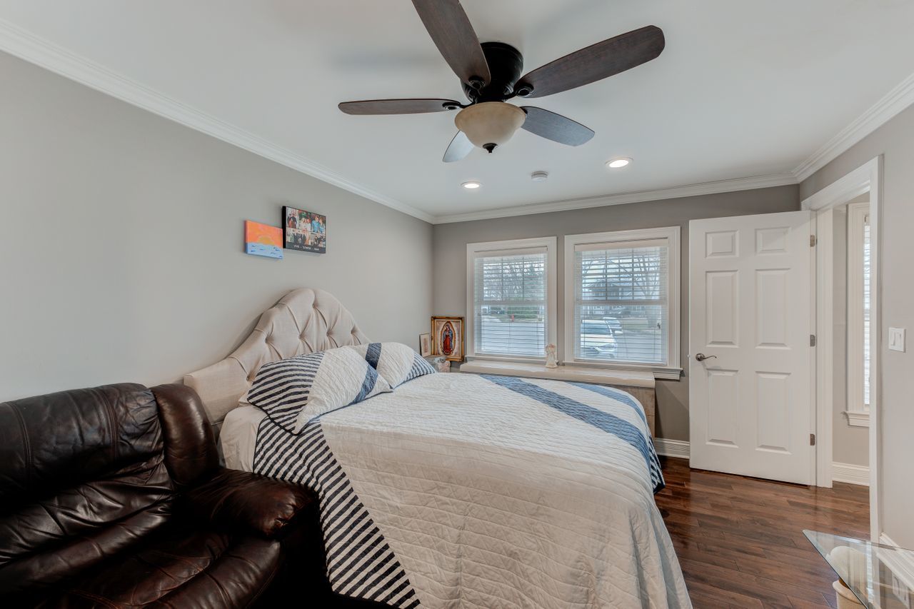 113 Saugatuck Road Montgomery, IL 60538 - Photo 11 of 19 a bedroom with a large bed and a window