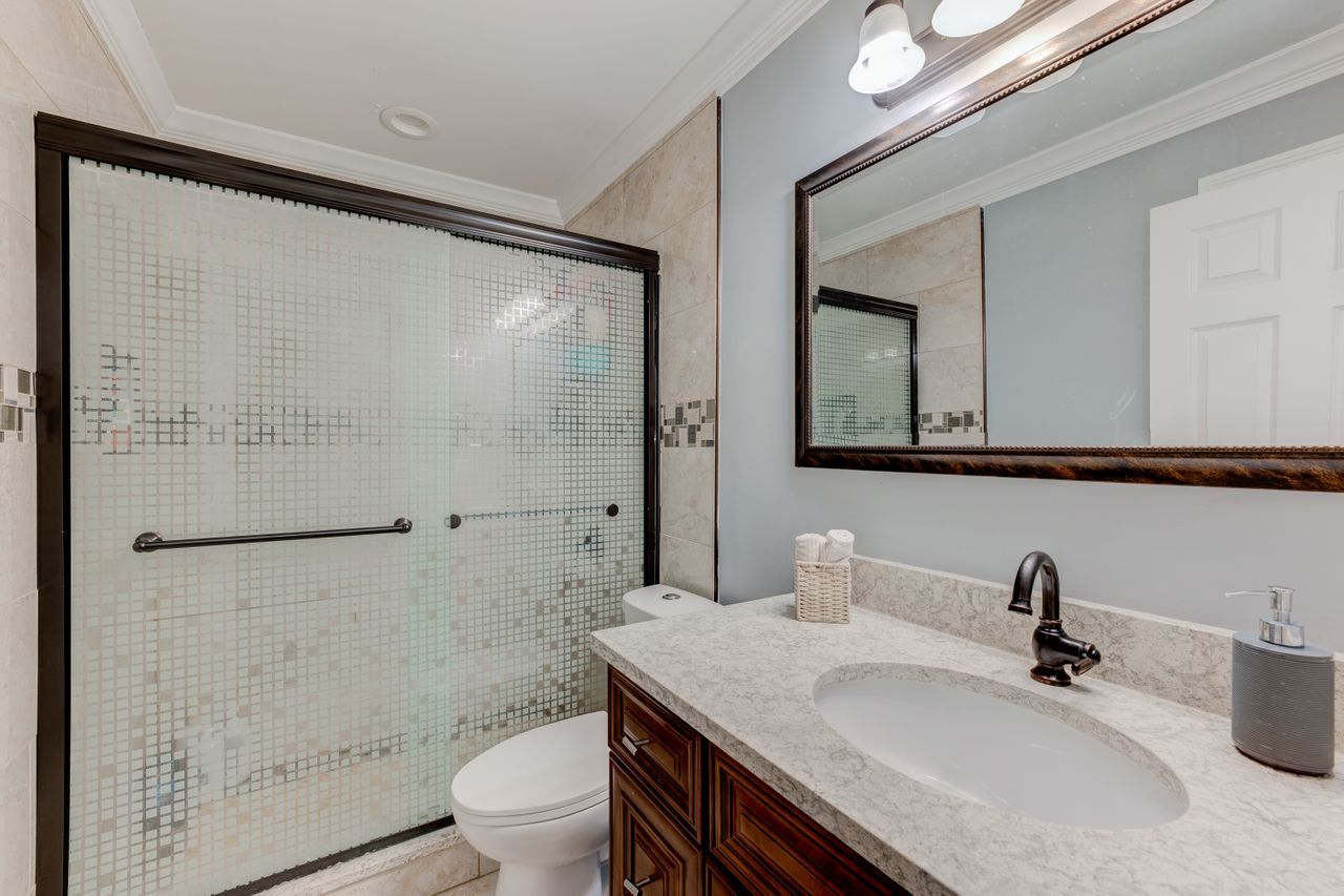 113 Saugatuck Road Montgomery, IL 60538 - Photo 8 of 19 a bathroom with a sink a toilet and shower