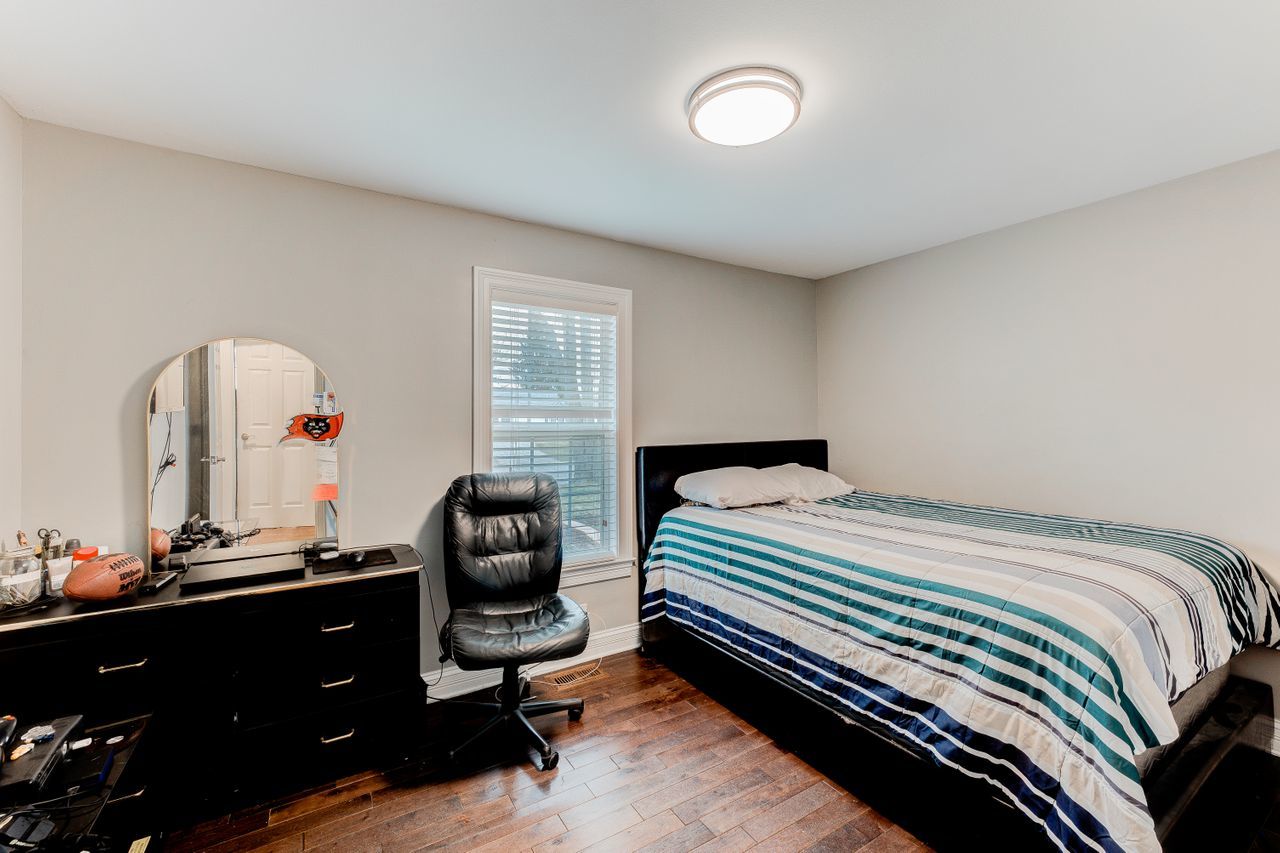 113 Saugatuck Road Montgomery, IL 60538 - Photo 9 of 19 a bedroom with a bed and a window