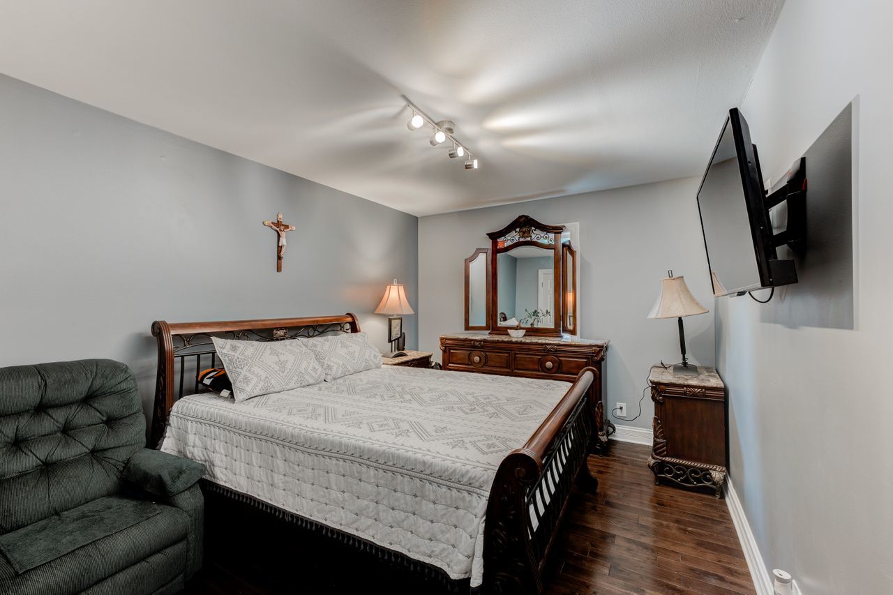 113 Saugatuck Road Montgomery, IL 60538 - Photo 10 of 19 a bedroom with a bed and a flat screen tv