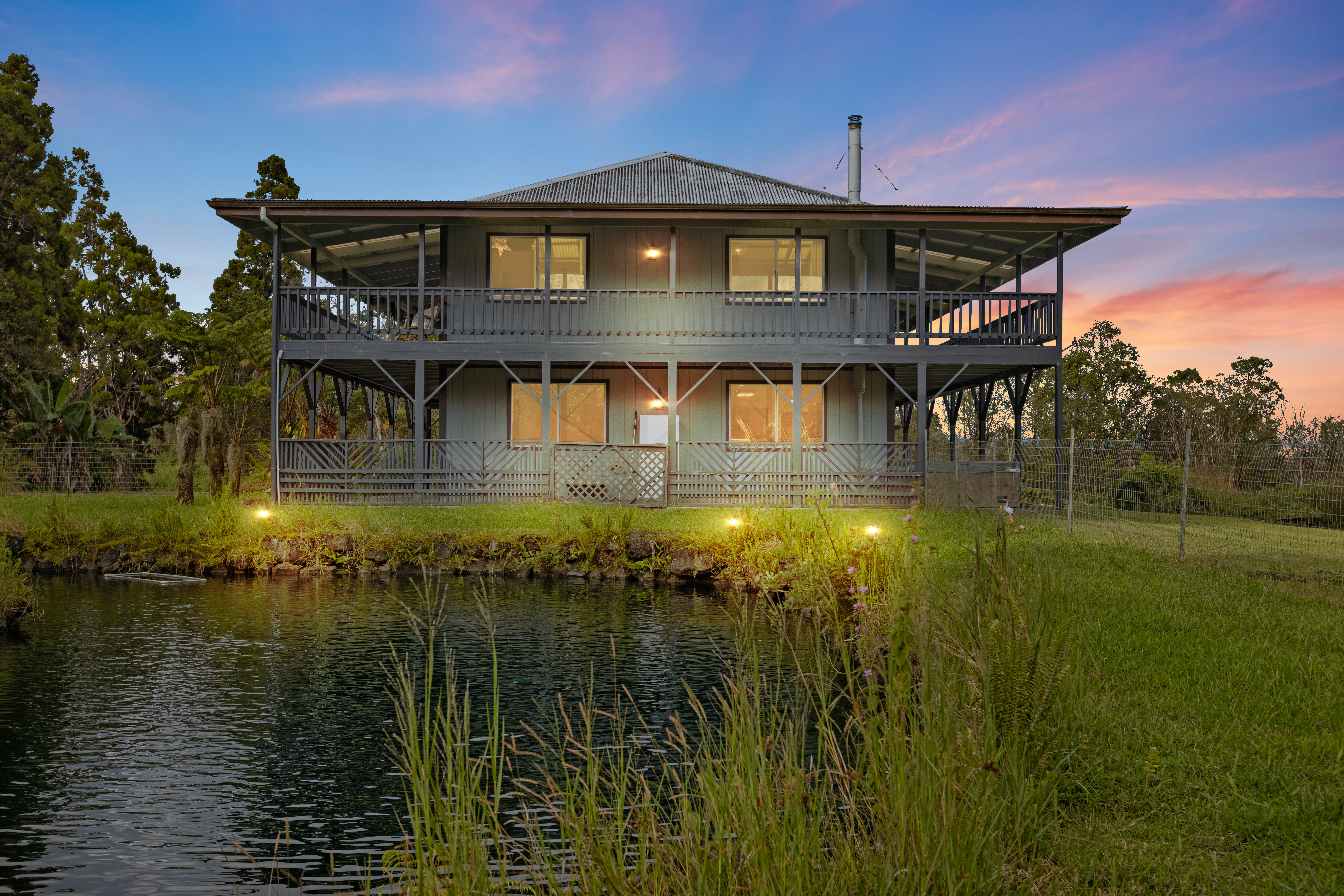 18-4565 Makaala Rd Mountain View Mountain View, HI 96771 - Photo 1 of 25 a front view of a house with a yard