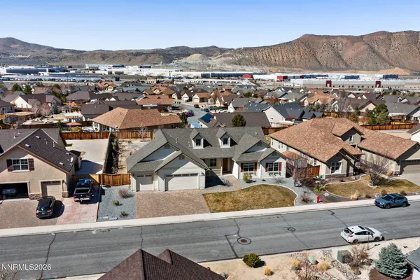 an aerial view of residential houses and outdoor space