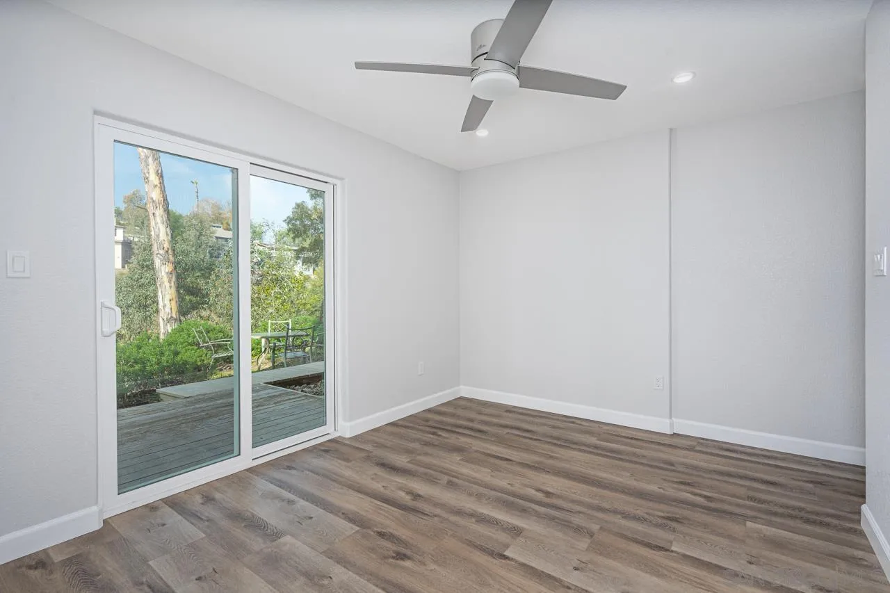 4310 Nabal Drive La Mesa, CA 91941 - Photo 11 of 20 a view of empty room with wooden floor and fan