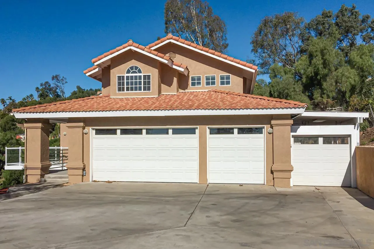 4310 Nabal Drive La Mesa, CA 91941 - Photo 19 of 20 a front view of a house with a garage and a balcony