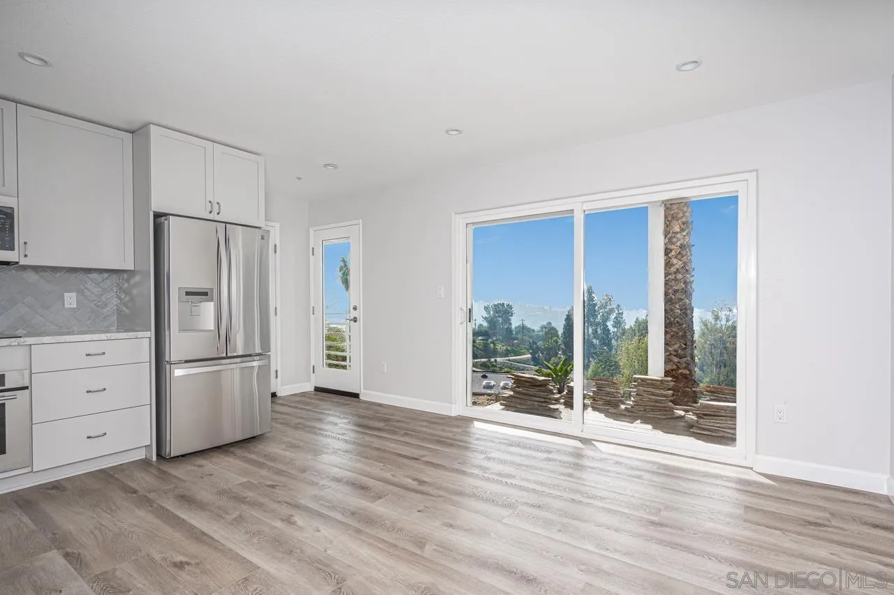 4310 Nabal Drive La Mesa, CA 91941 - Photo 7 of 20 a kitchen with a refrigerator and wooden floor