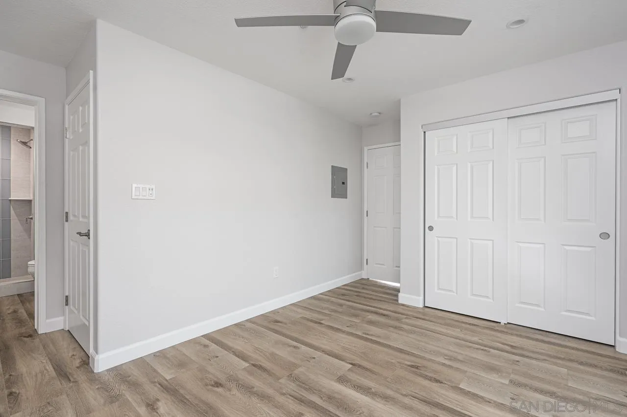 4310 Nabal Drive La Mesa, CA 91941 - Photo 8 of 20 a view of room with hardwood floor and ceiling fan