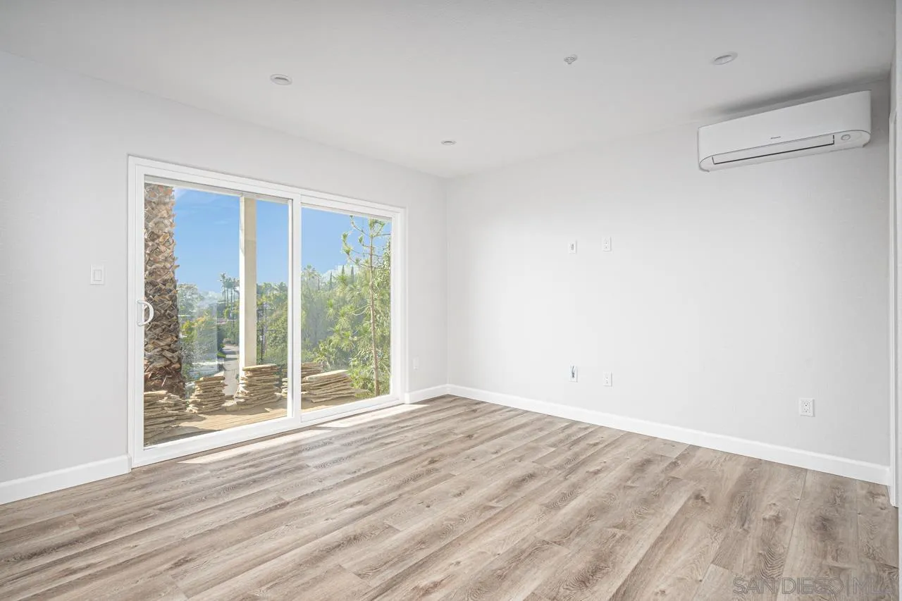 4310 Nabal Drive La Mesa, CA 91941 - Photo 10 of 20 a view of an empty room with wooden floor and a window