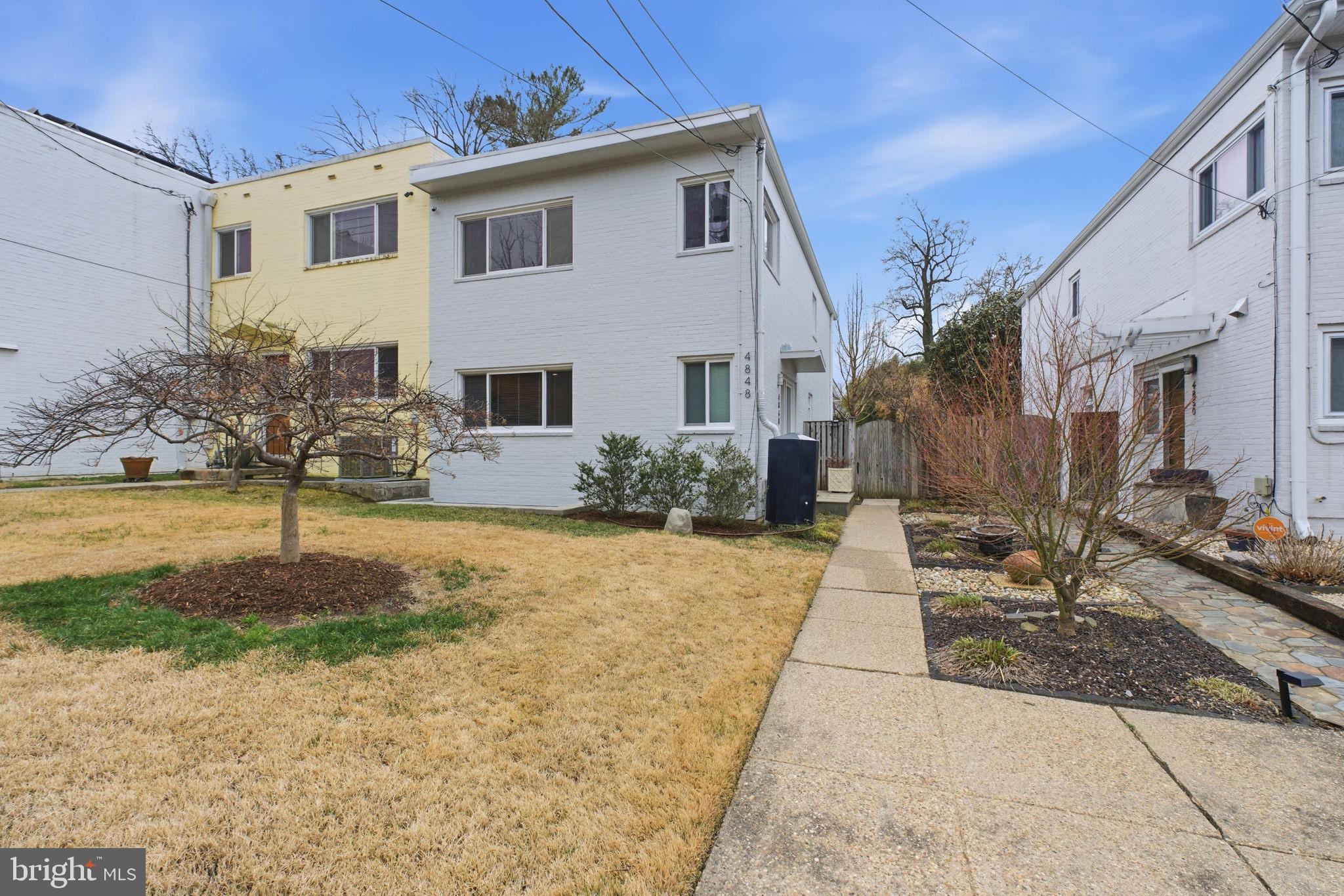 4848 Reservoir Road Northwest Washington, DC 20007 - Photo 1 of 49 a view of a house with backyard and sitting area