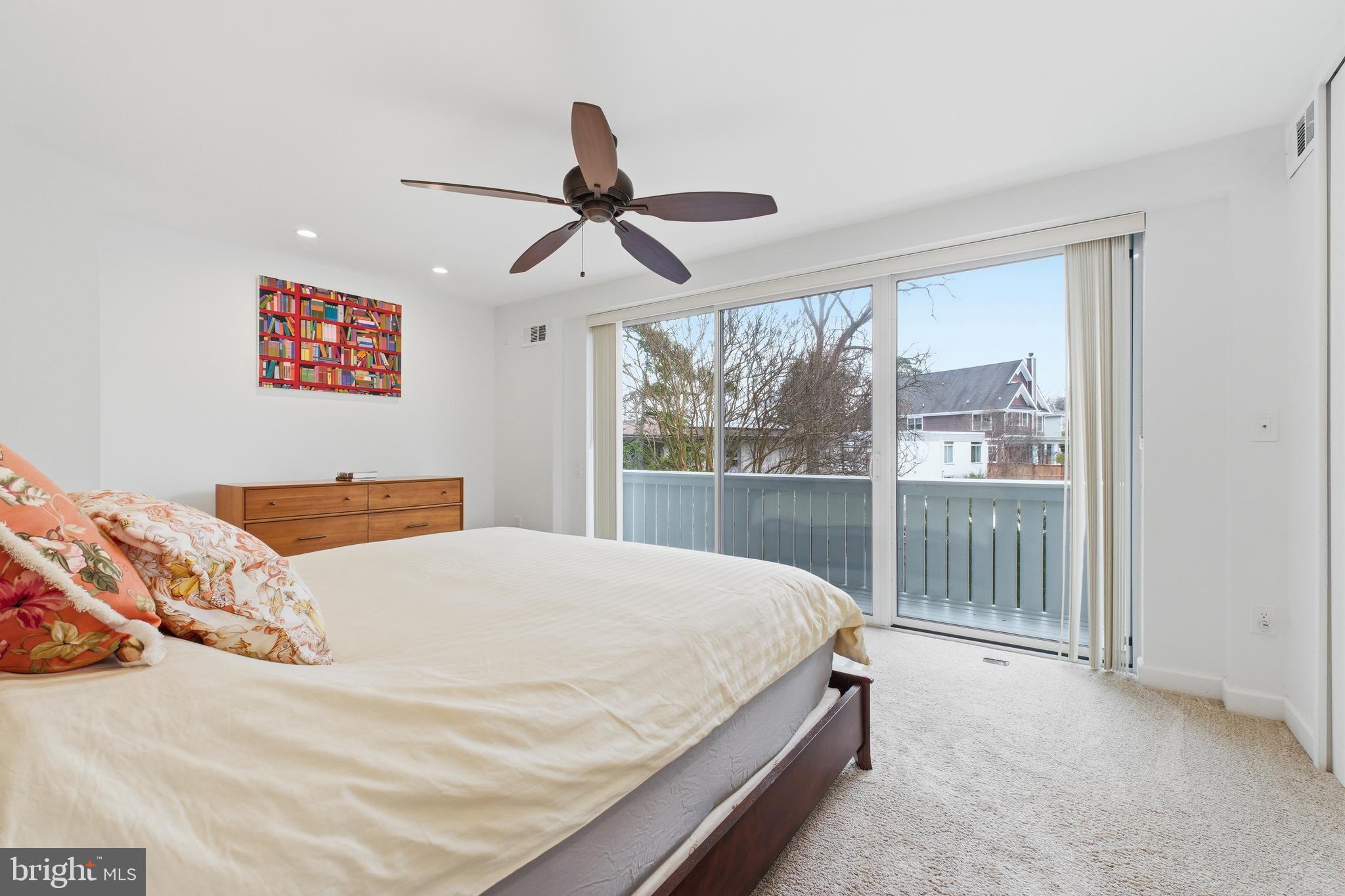 4848 Reservoir Road Northwest Washington, DC 20007 - Photo 18 of 49 a bedroom with a large bed and a large window
