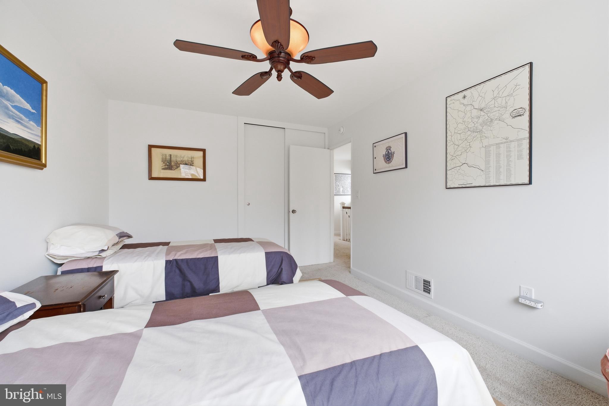 4848 Reservoir Road Northwest Washington, DC 20007 - Photo 23 of 49 a bedroom with a bed and painting on the wall