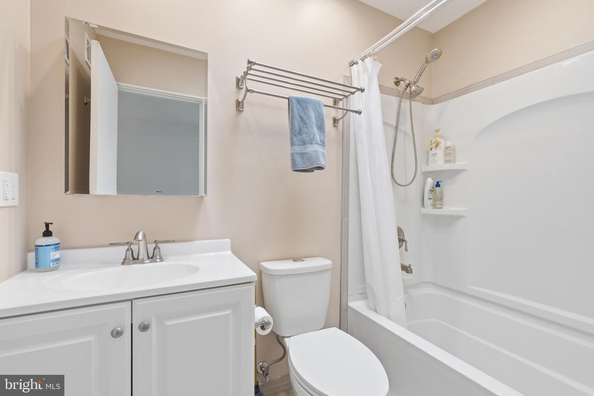 4848 Reservoir Road Northwest Washington, DC 20007 - Photo 24 of 49 a bathroom with a sink toilet and shower