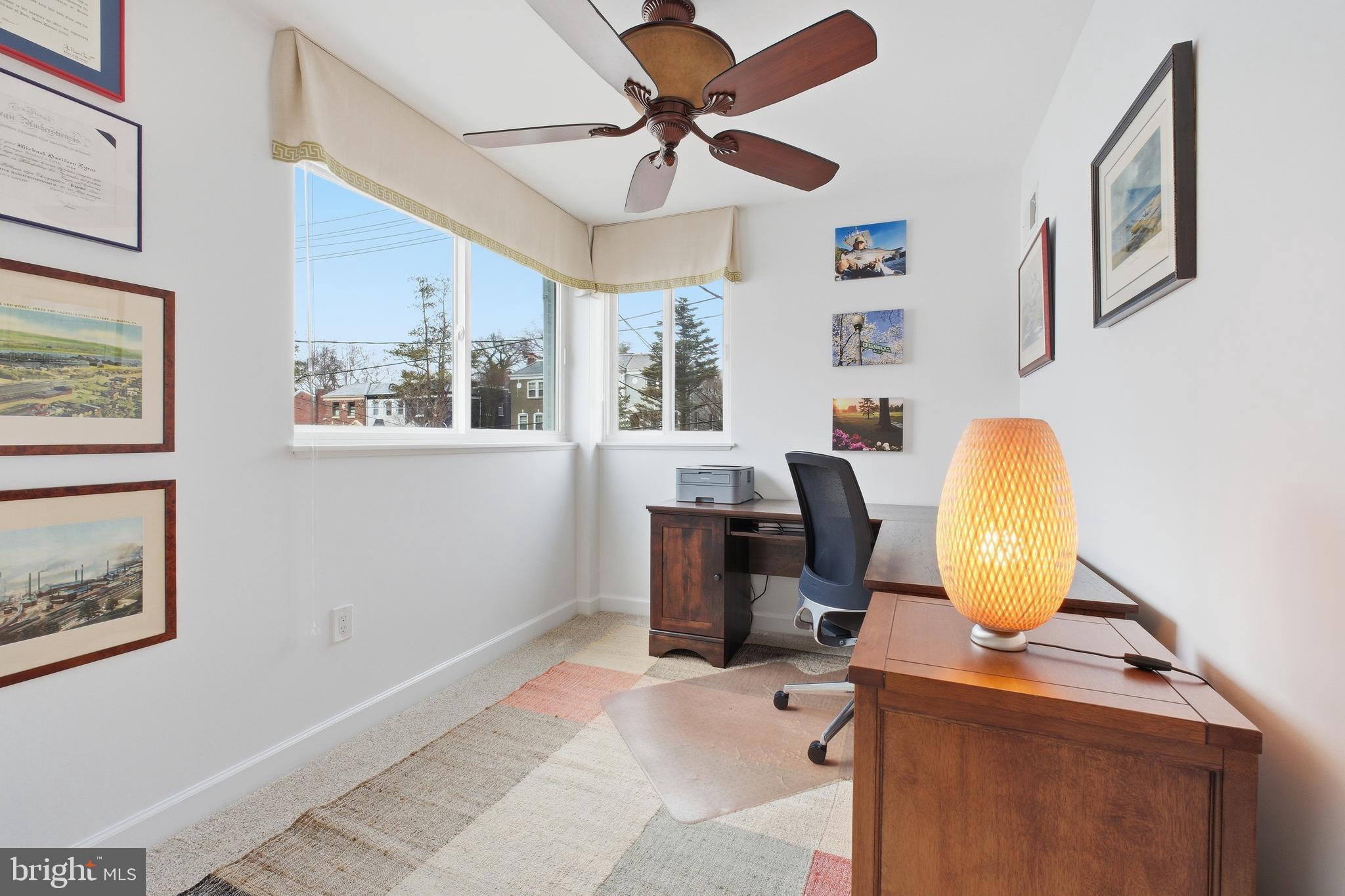 4848 Reservoir Road Northwest Washington, DC 20007 - Photo 25 of 49 a view of a workspace with furniture and a window