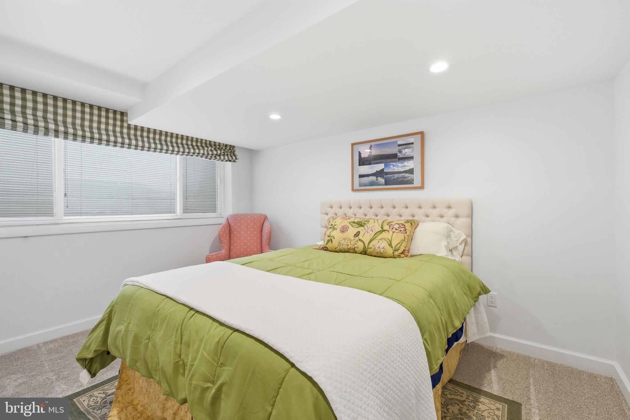 4848 Reservoir Road Northwest Washington, DC 20007 - Photo 28 of 49 a bedroom with a bed and a window