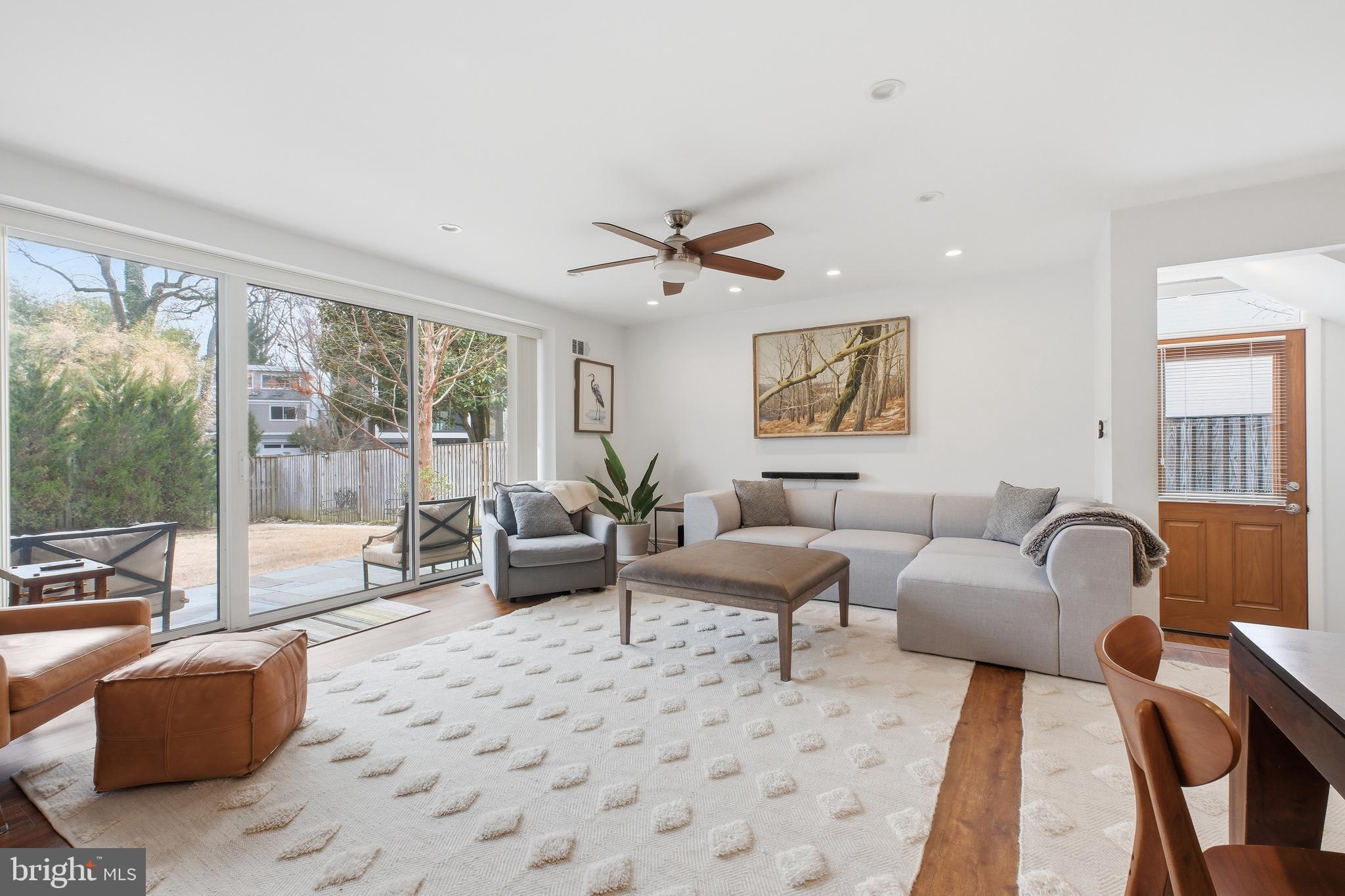 4848 Reservoir Road Northwest Washington, DC 20007 - Photo 3 of 49 a living room with furniture and a large window with garden view