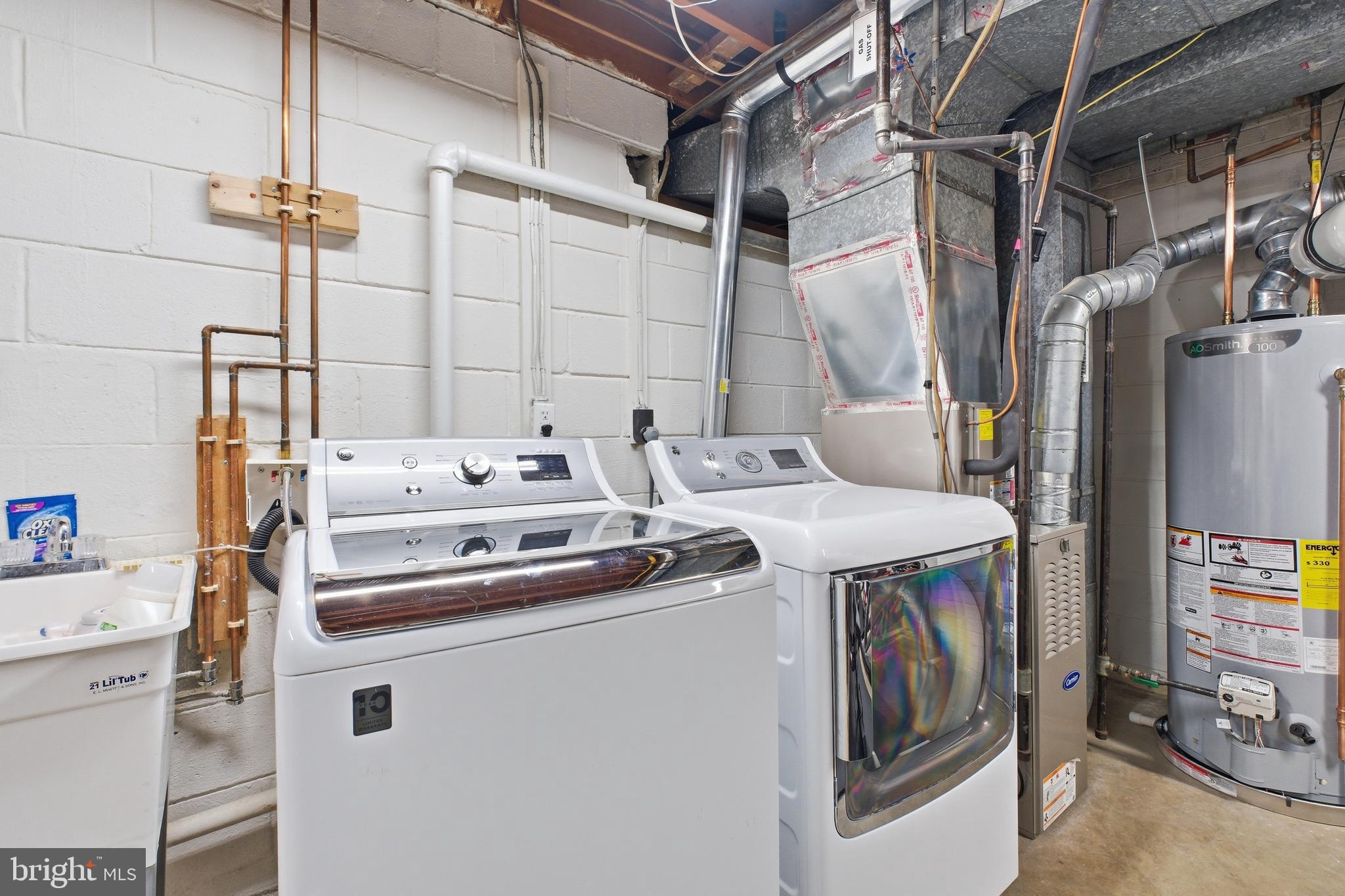 4848 Reservoir Road Northwest Washington, DC 20007 - Photo 31 of 49 a utility room with dryer and washer