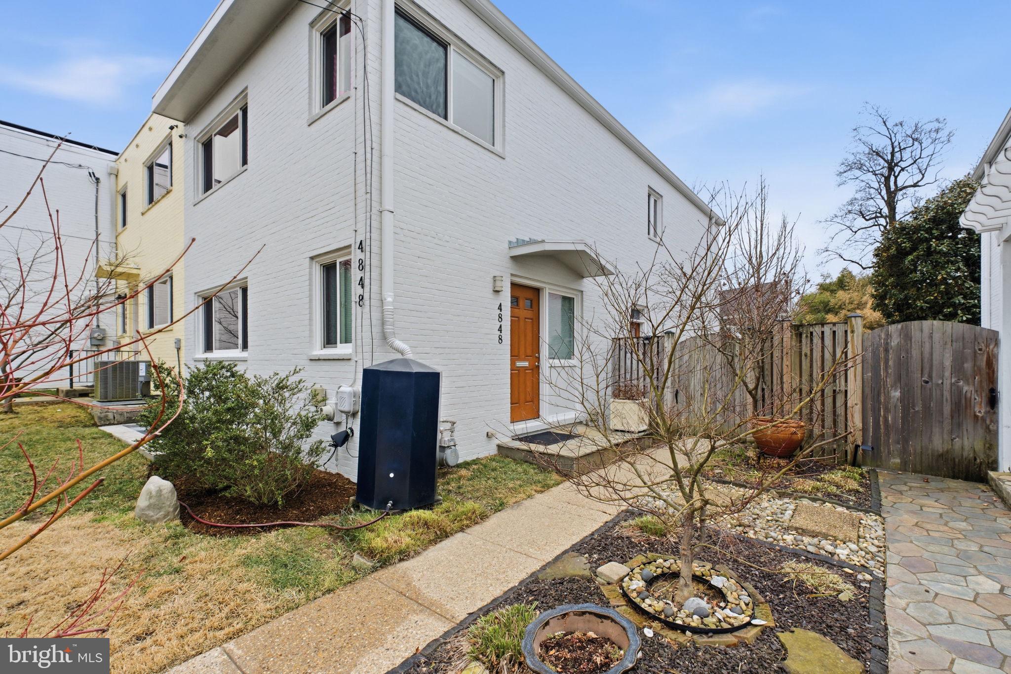4848 Reservoir Road Northwest Washington, DC 20007 - Photo 45 of 49 a view of a chairs and table in backyard