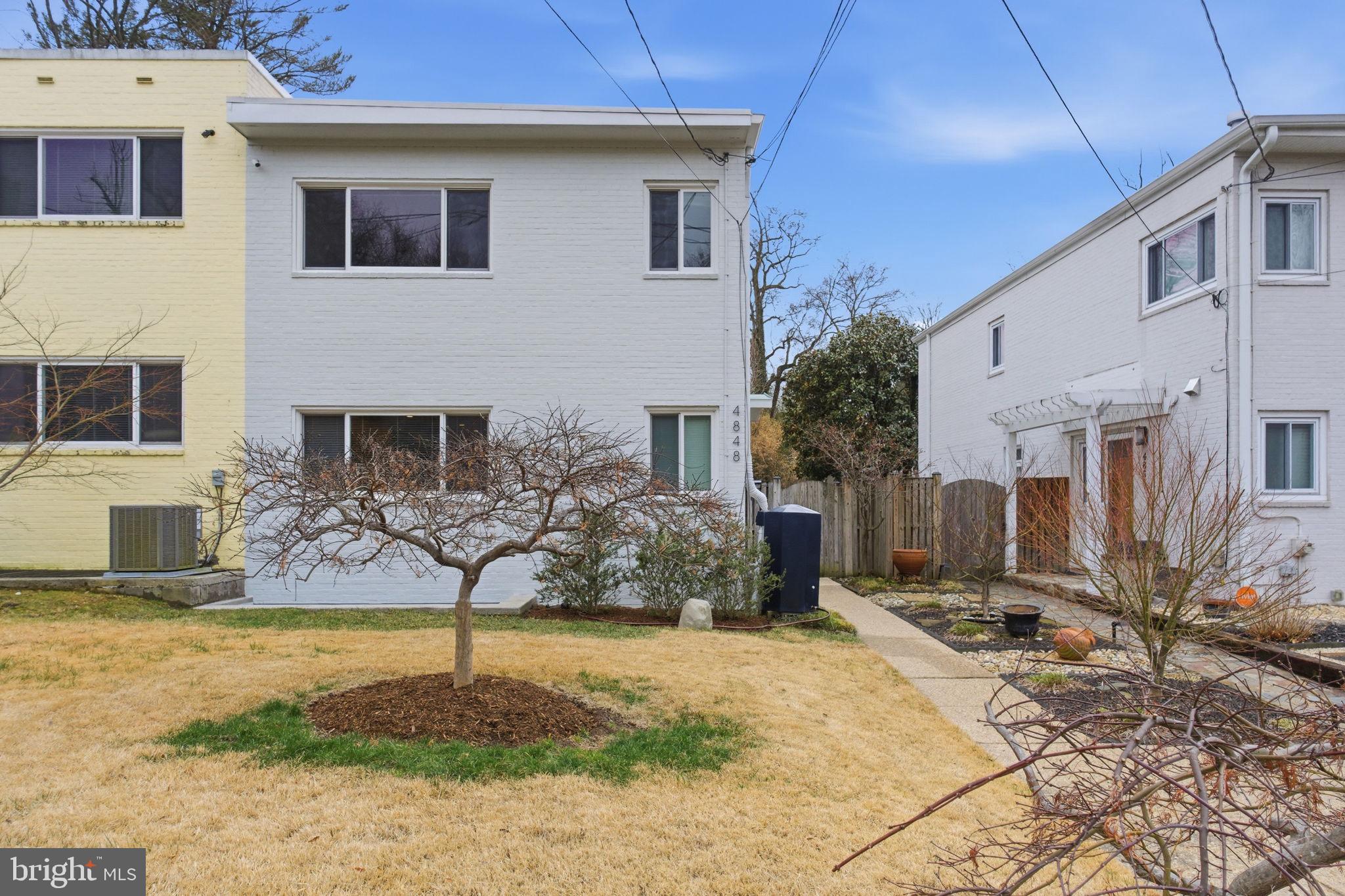 4848 Reservoir Road Northwest Washington, DC 20007 - Photo 46 of 49 a front view of a house with garden