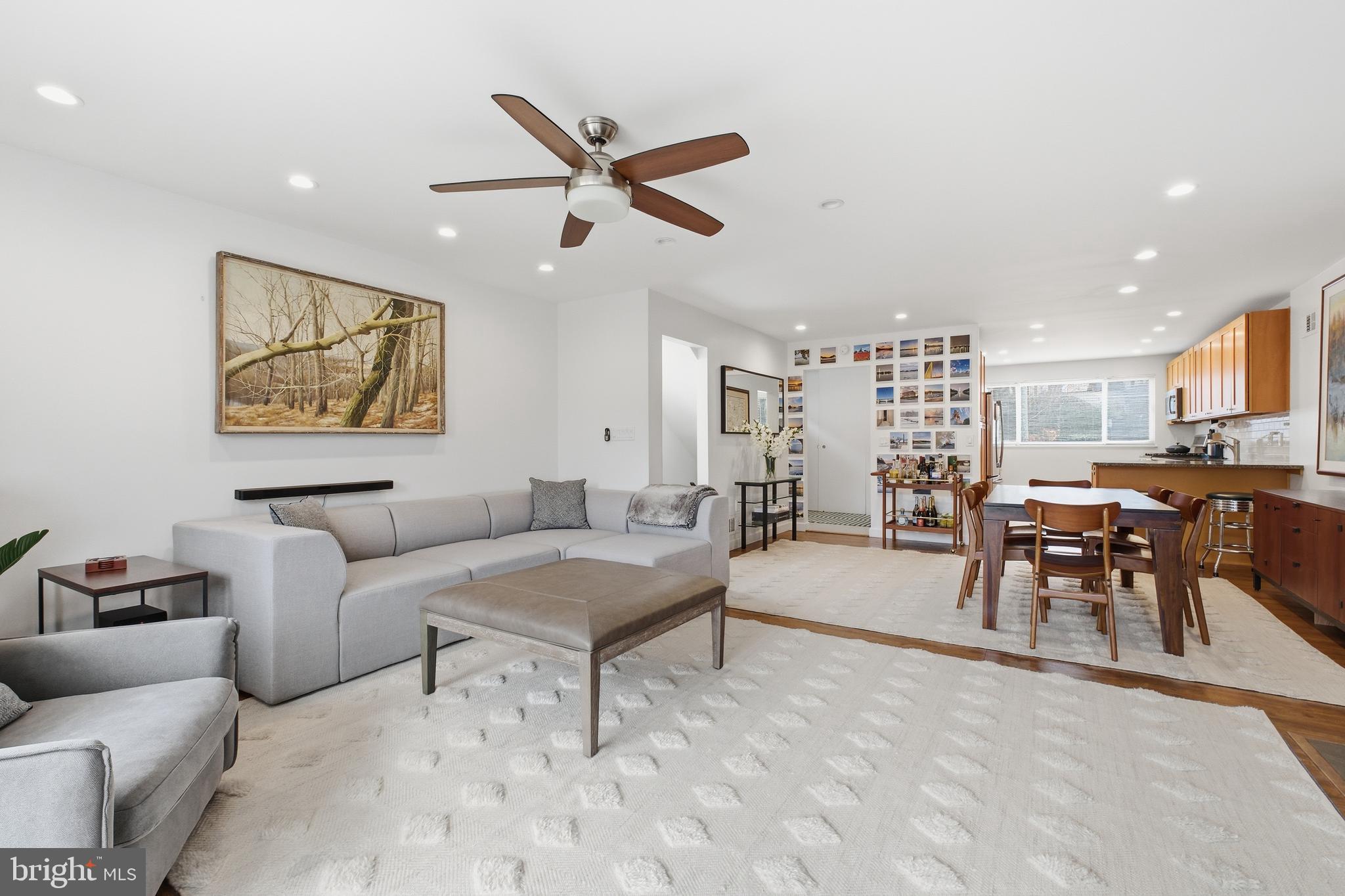 4848 Reservoir Road Northwest Washington, DC 20007 - Photo 6 of 49 a living room with furniture and kitchen view