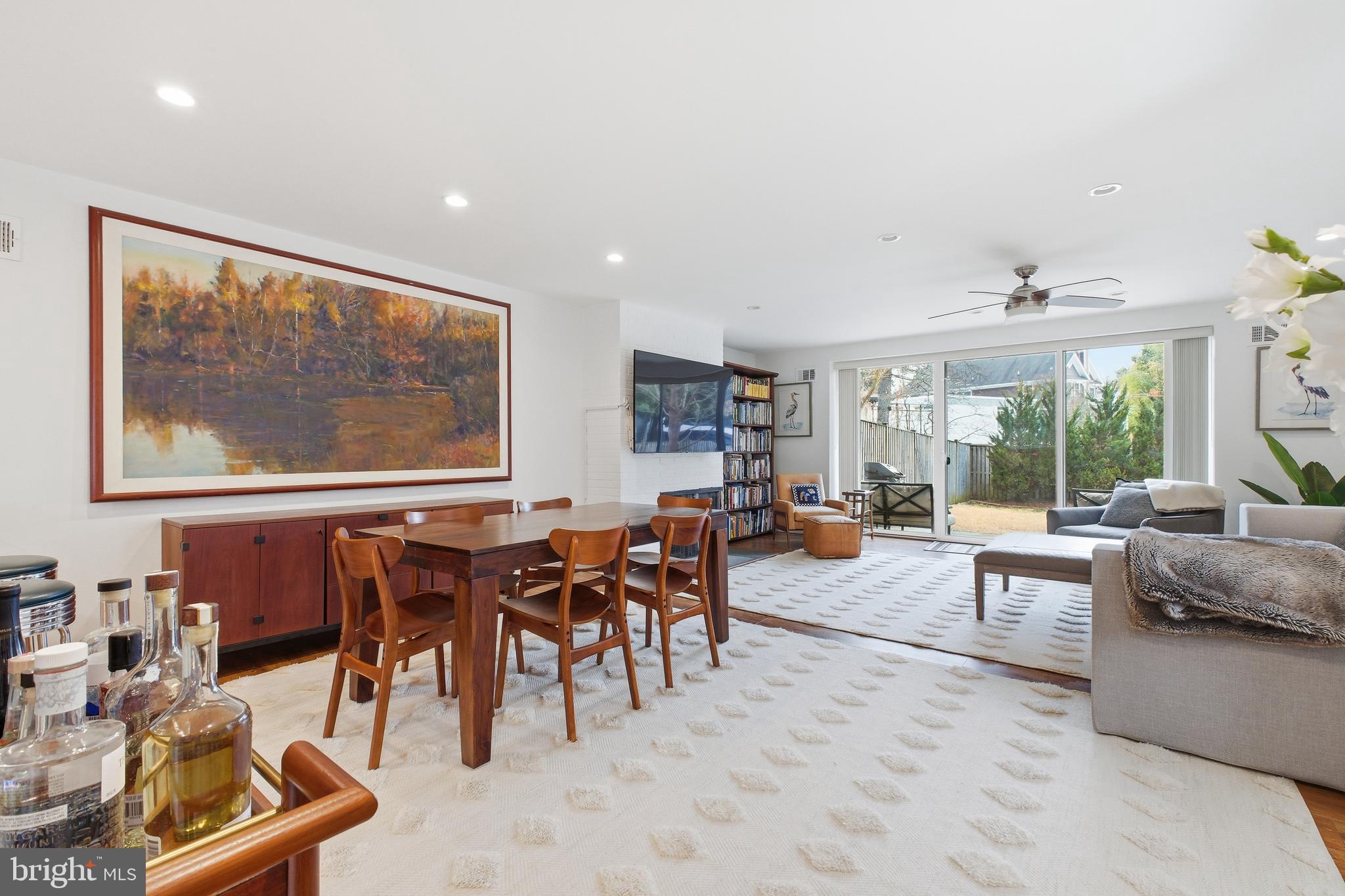 4848 Reservoir Road Northwest Washington, DC 20007 - Photo 9 of 49 a living room with furniture and a large window