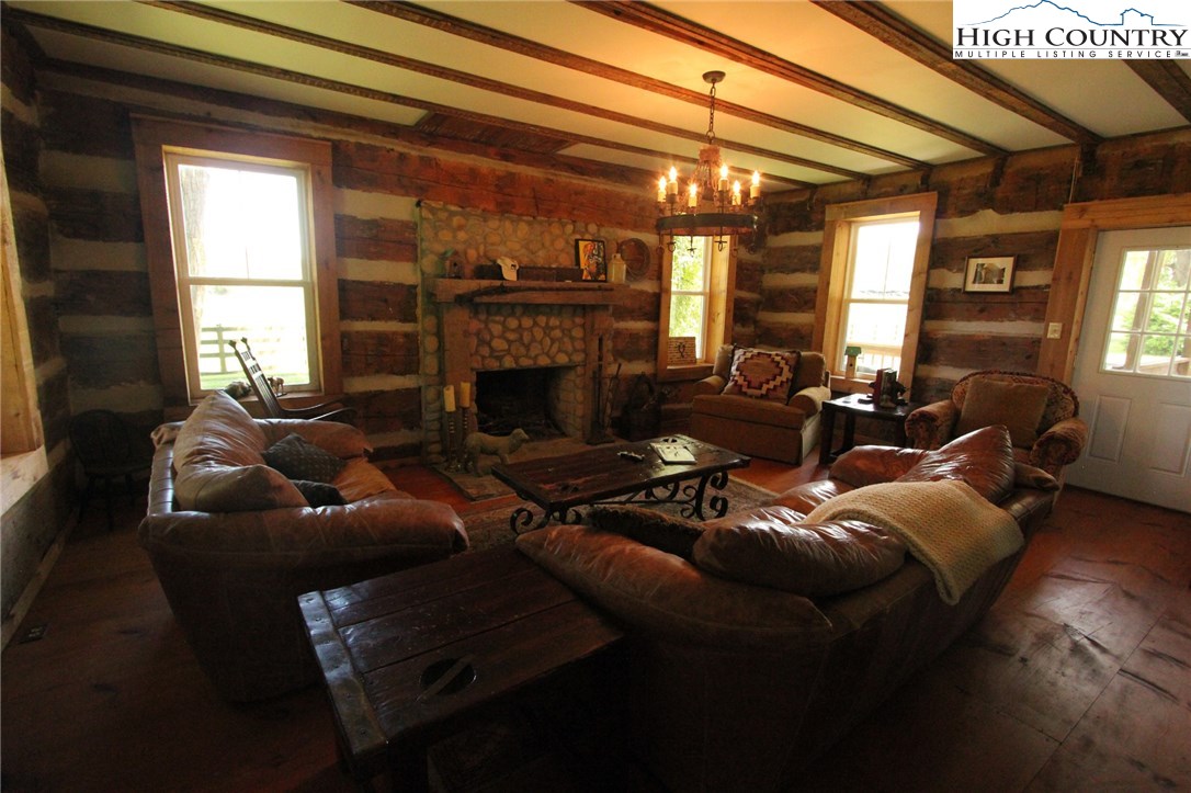 4513 Cedar Springs Road Speedwell, VA 24374 - Photo 18 of 49 a living room with furniture and a fireplace