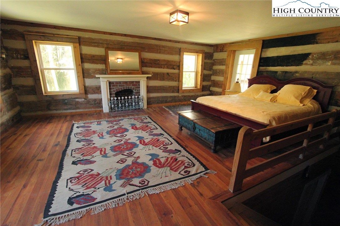 4513 Cedar Springs Road Speedwell, VA 24374 - Photo 27 of 49 a spacious bedroom with a bed and wooden floor