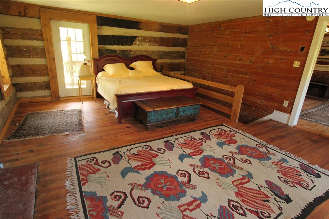 4513 Cedar Springs Road Speedwell, VA 24374 - Photo 29 of 49 a bedroom with wooden floor