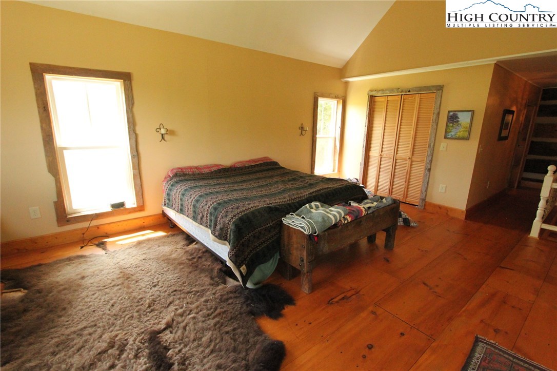 4513 Cedar Springs Road Speedwell, VA 24374 - Photo 33 of 49 a spacious bedroom with a bed and a window