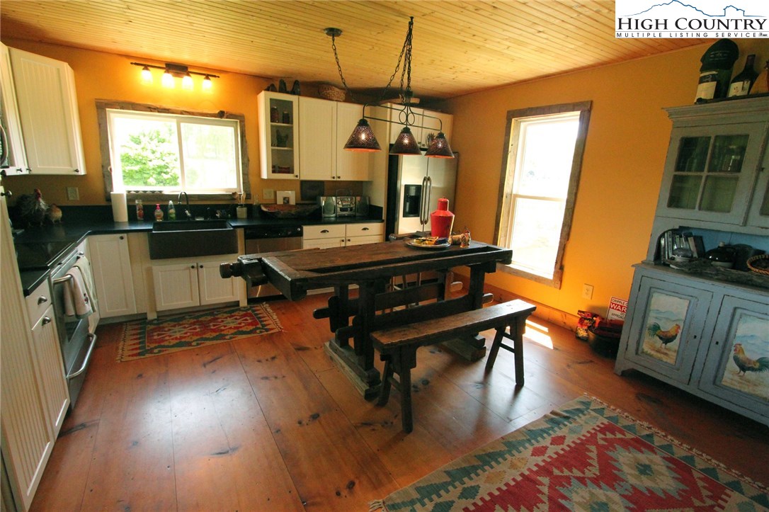 4513 Cedar Springs Road Speedwell, VA 24374 - Photo 7 of 49 a dining room with furniture and wooden floor