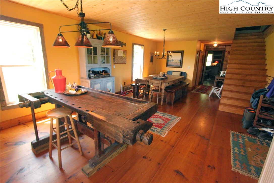 4513 Cedar Springs Road Speedwell, VA 24374 - Photo 9 of 49 a living room with furniture a dining table and chairs with wooden floor