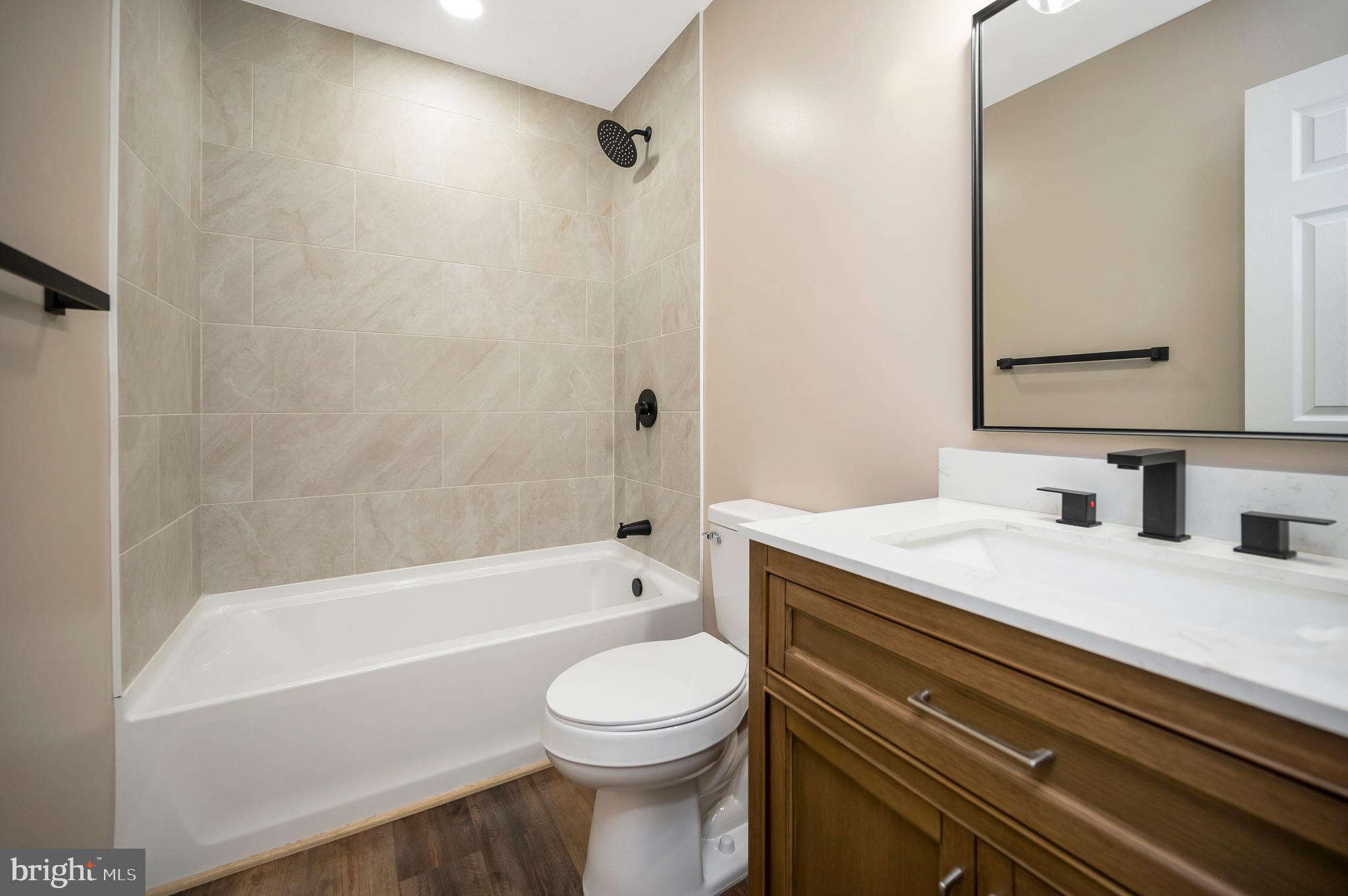13452 Post Oak Road Spotsylvania, VA 22551 - Photo 34 of 56 a bathroom with a sink a toilet and a bathtub
