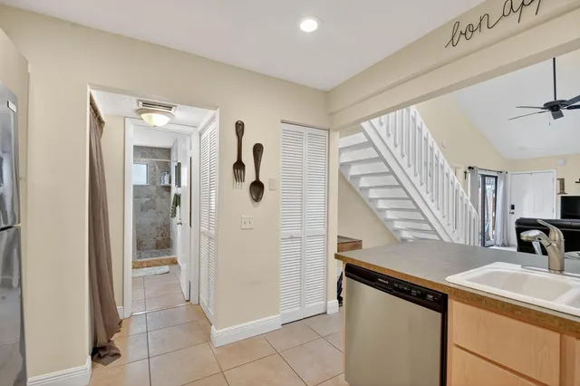 a view of a kitchen from the hallway