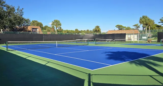 a view of an outdoor space and basketball court