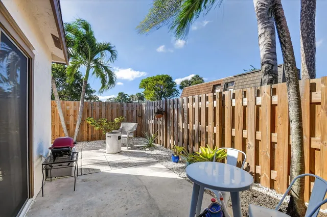 a view of a chairs and table in the patio