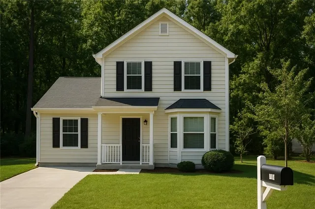 a view of a house with a yard