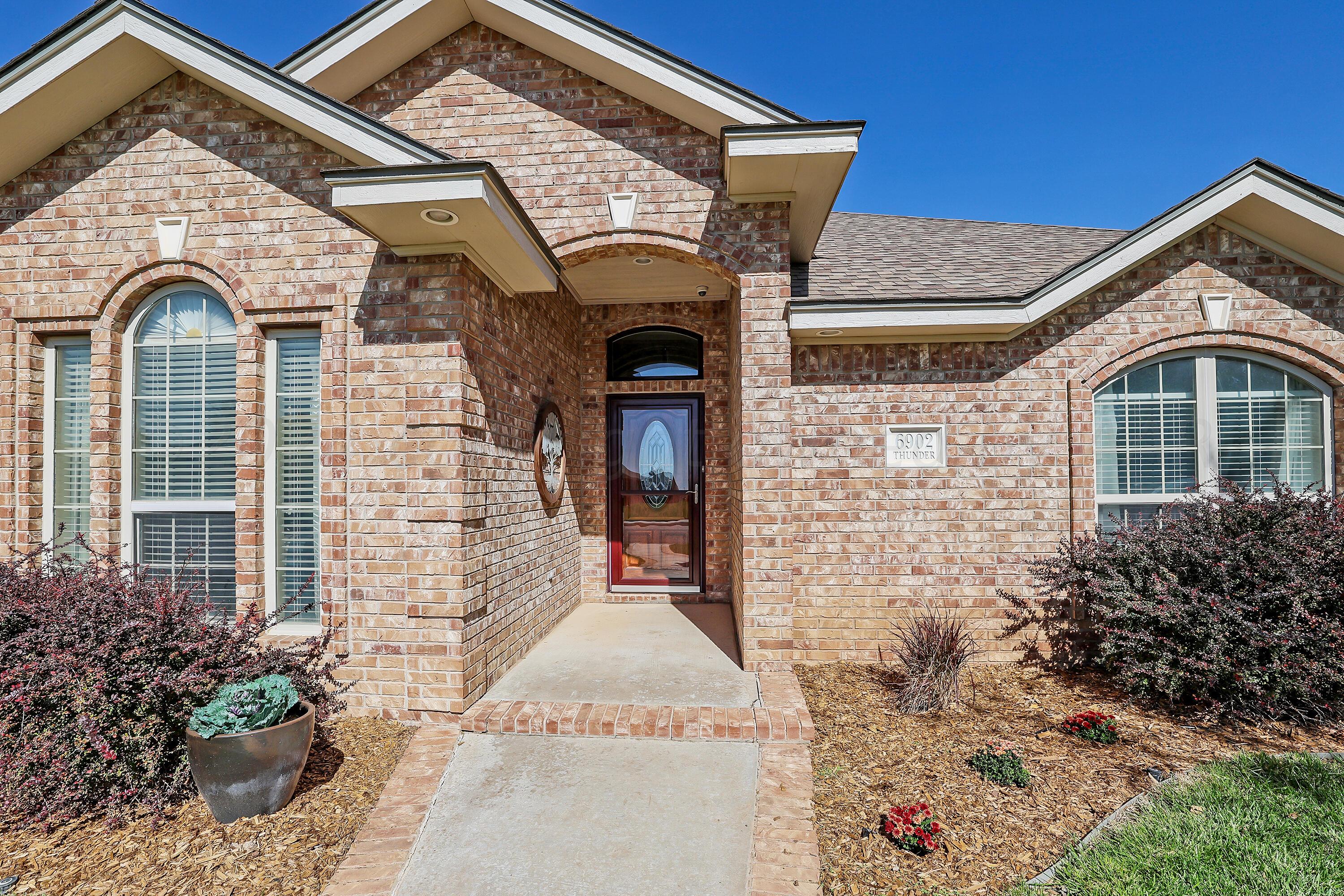 6902 Thunder Road Amarillo, TX 79119 - Photo 2 of 32 a front view of a house