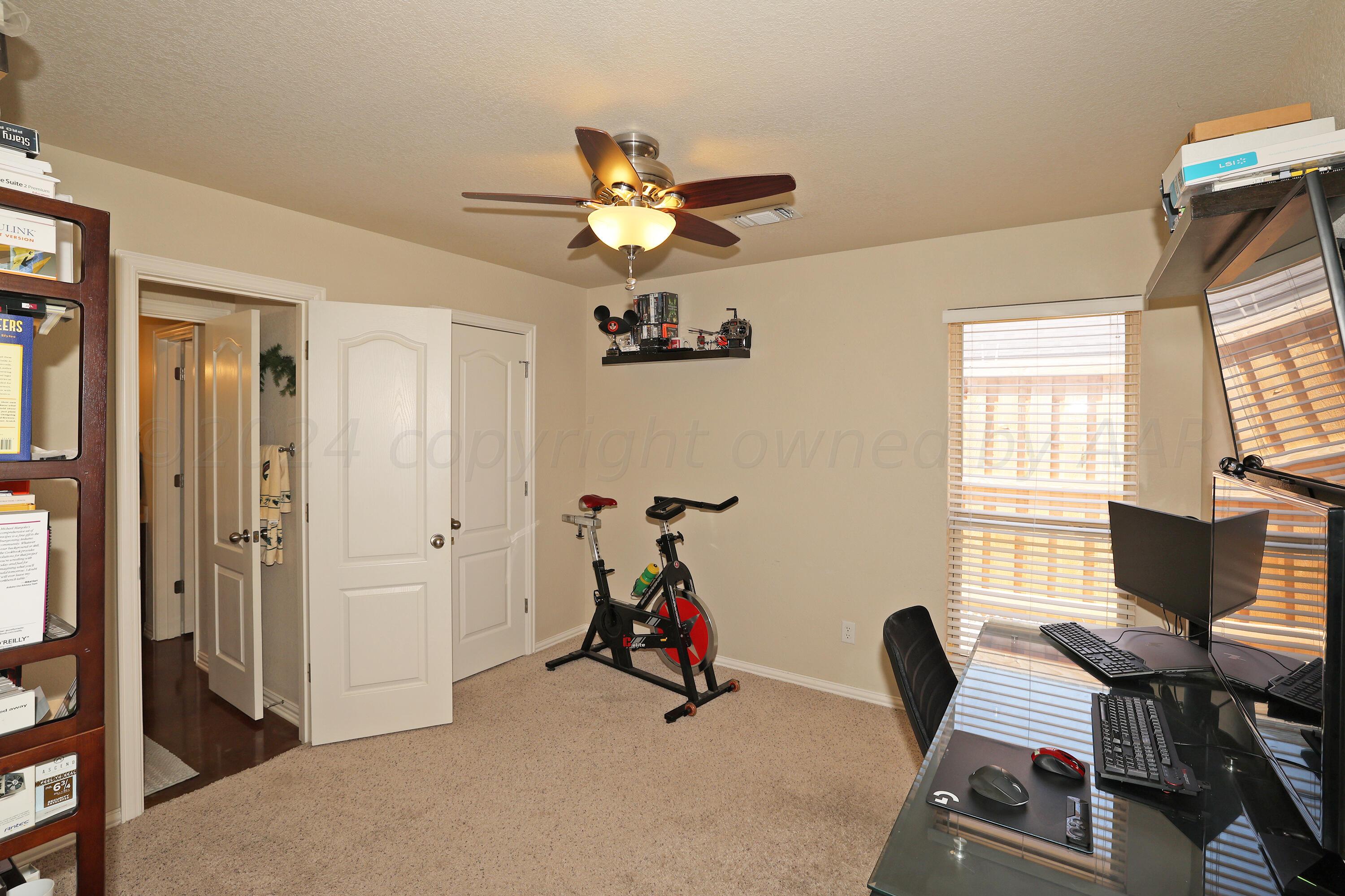 6902 Thunder Road Amarillo, TX 79119 - Photo 23 of 32 a room with furniture and a window