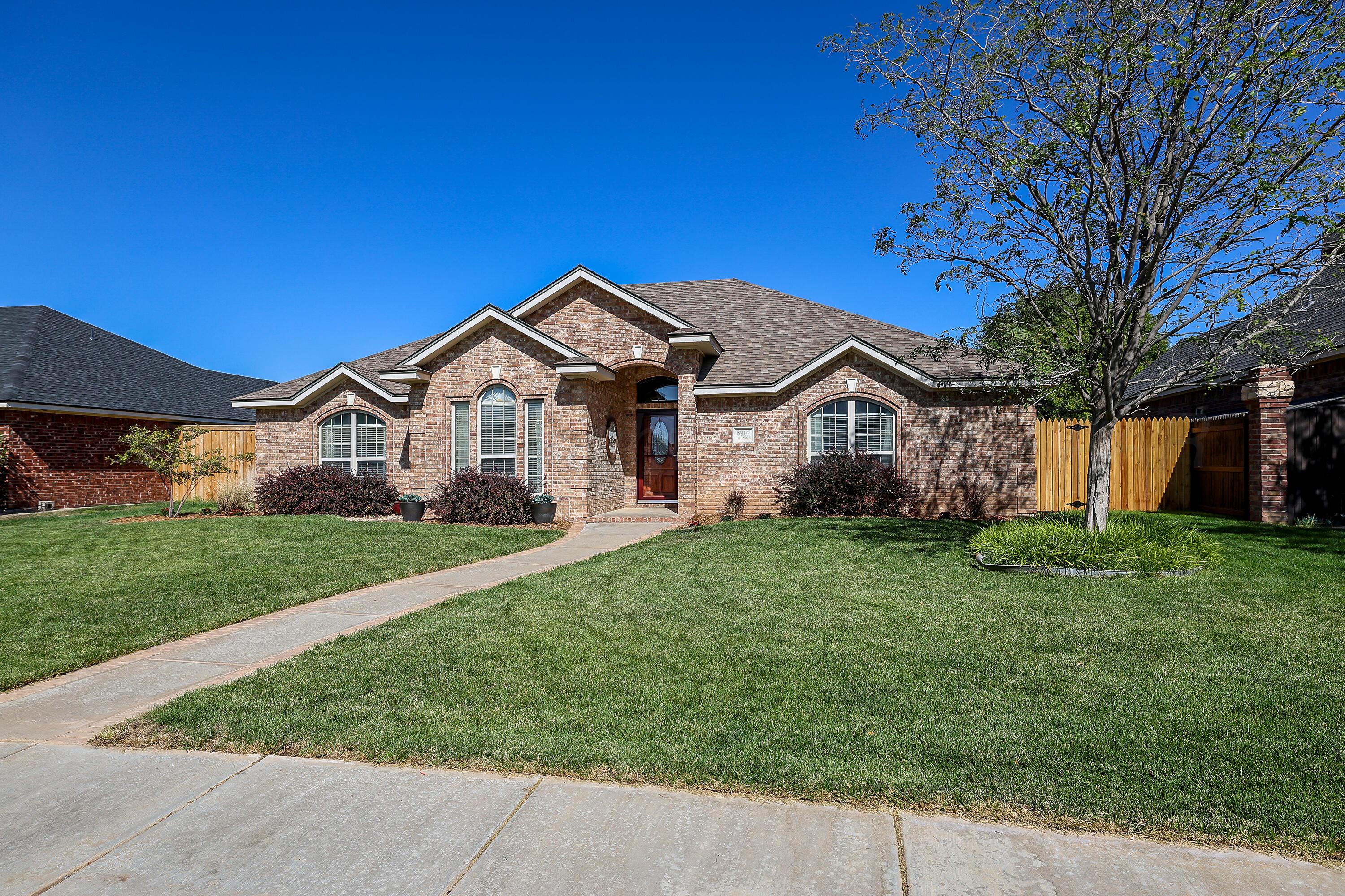6902 Thunder Road Amarillo, TX 79119 - Photo 32 of 32 a view of a house with a big yard plants and large trees