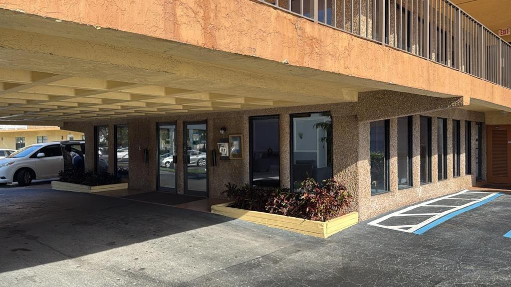 9273 Southwest 8th Street, Unit 216 Boca Raton, FL 33428 - Photo 7 of 7 a view of a porch