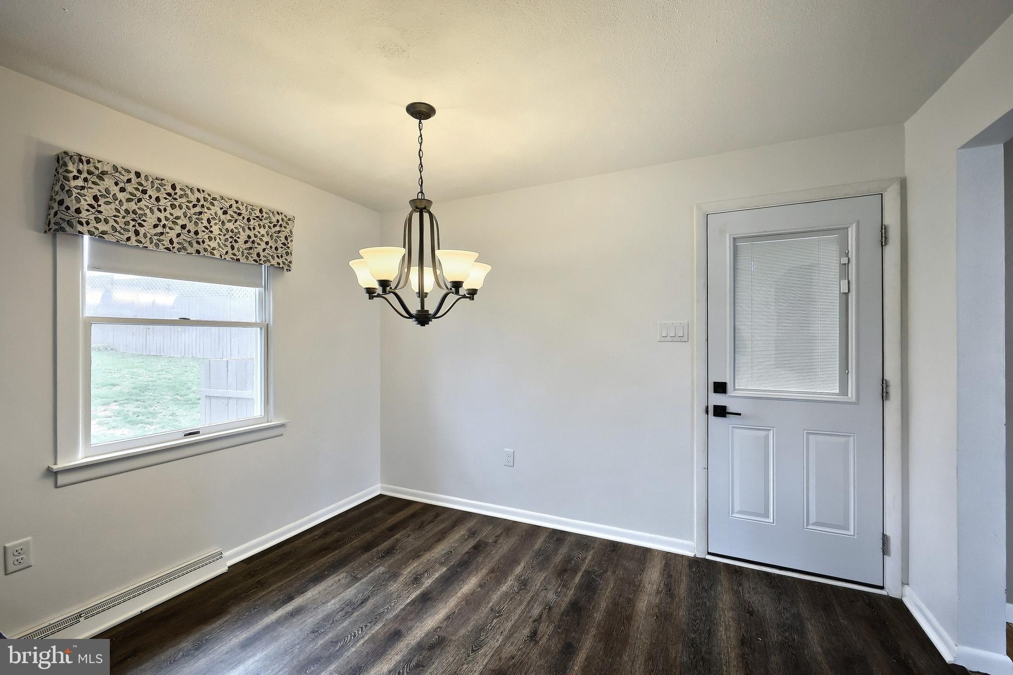 13 Circle Drive Jacobus, PA 17407 - Photo 11 of 53 a view of empty room with wooden floor and window