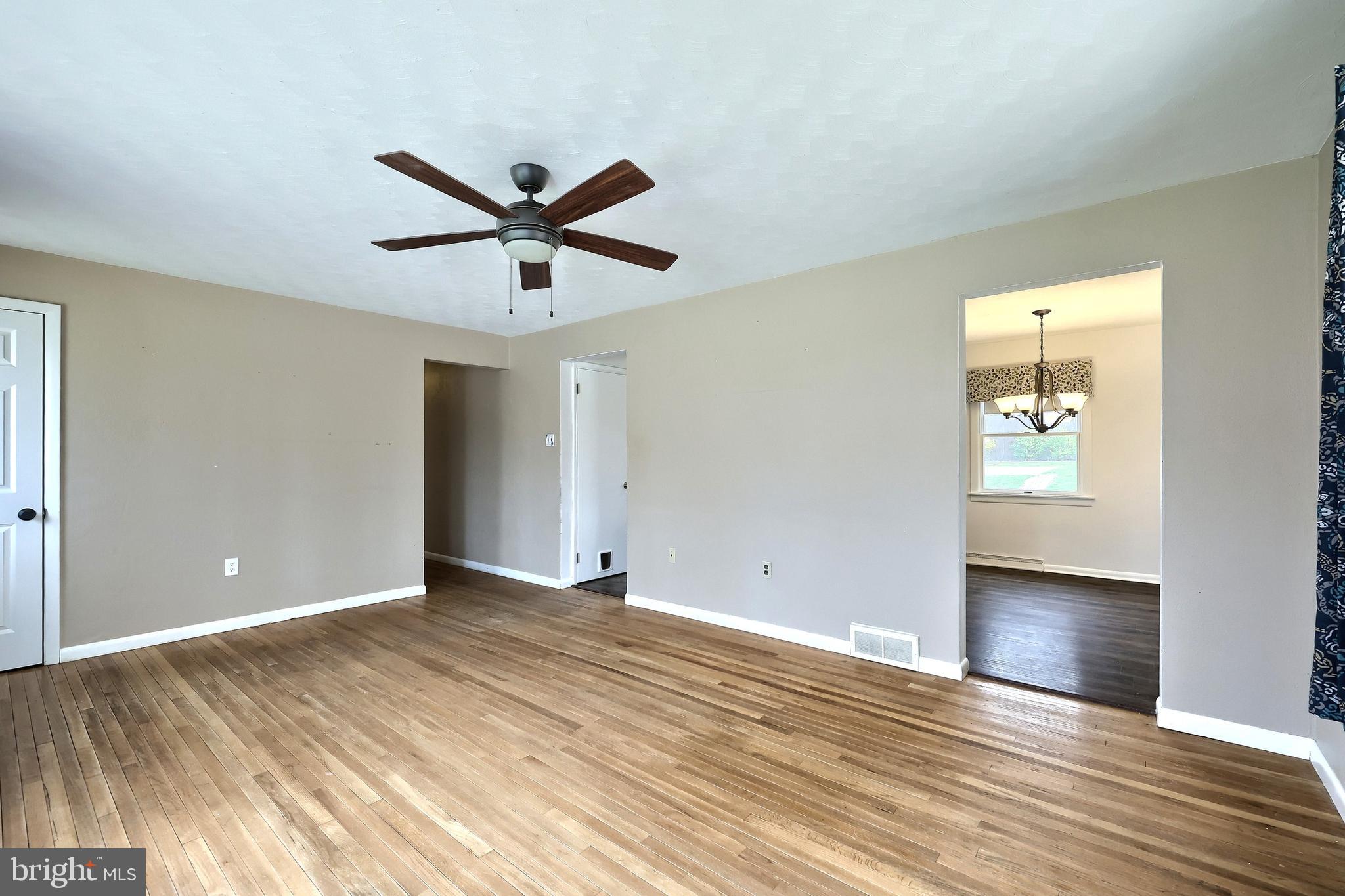 13 Circle Drive Jacobus, PA 17407 - Photo 12 of 53 an empty room with wooden floor and windows
