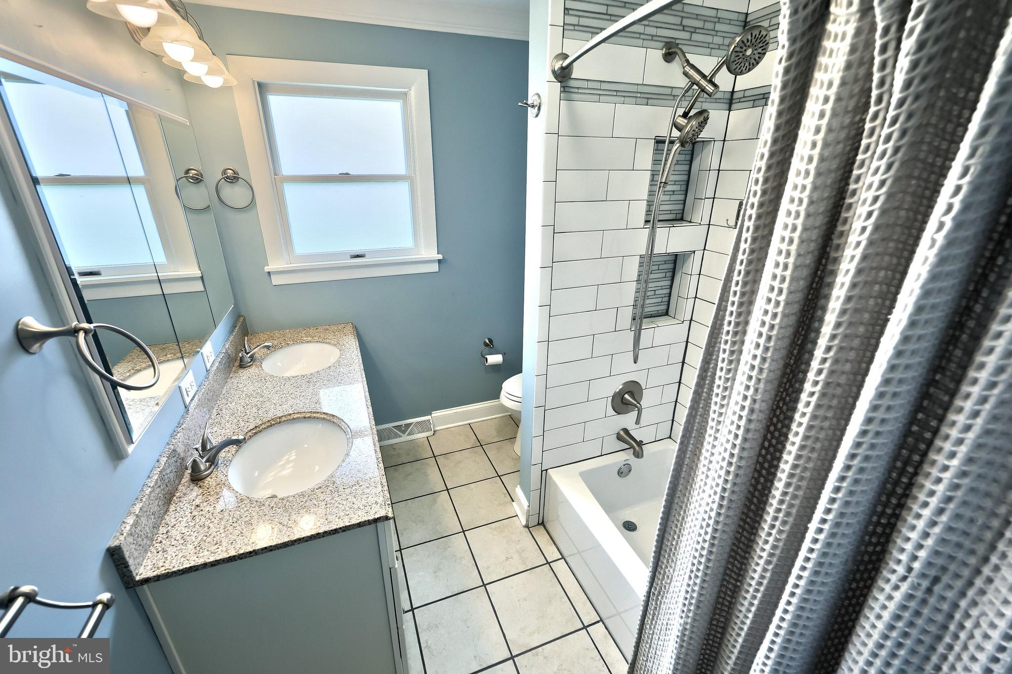 13 Circle Drive Jacobus, PA 17407 - Photo 19 of 53 a bathroom with a granite countertop sink a mirror and shower