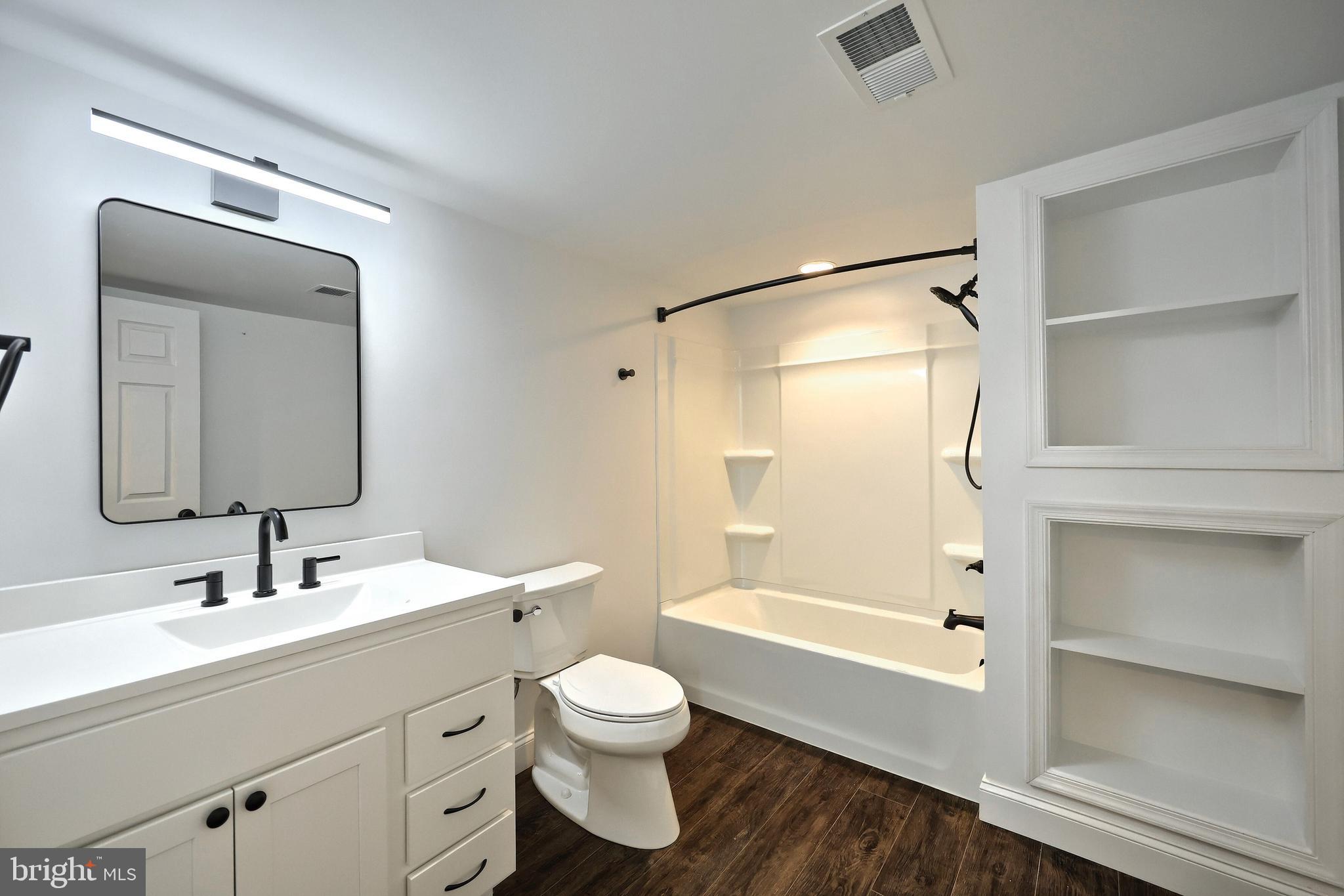 13 Circle Drive Jacobus, PA 17407 - Photo 27 of 53 a bathroom with a bathtub shower sink vanity and toilet