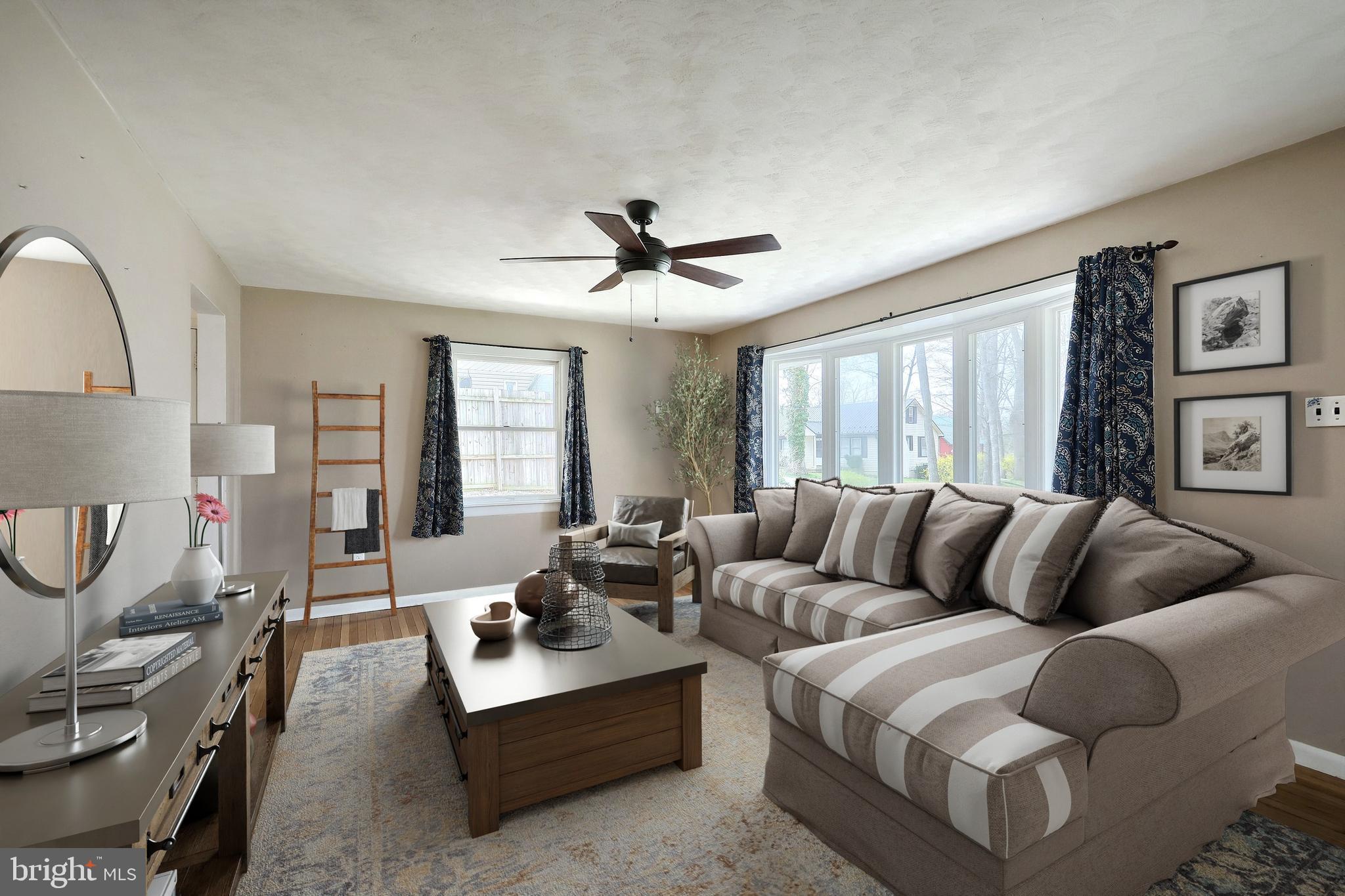13 Circle Drive Jacobus, PA 17407 - Photo 3 of 53 a living room with furniture a ceiling fan and a window