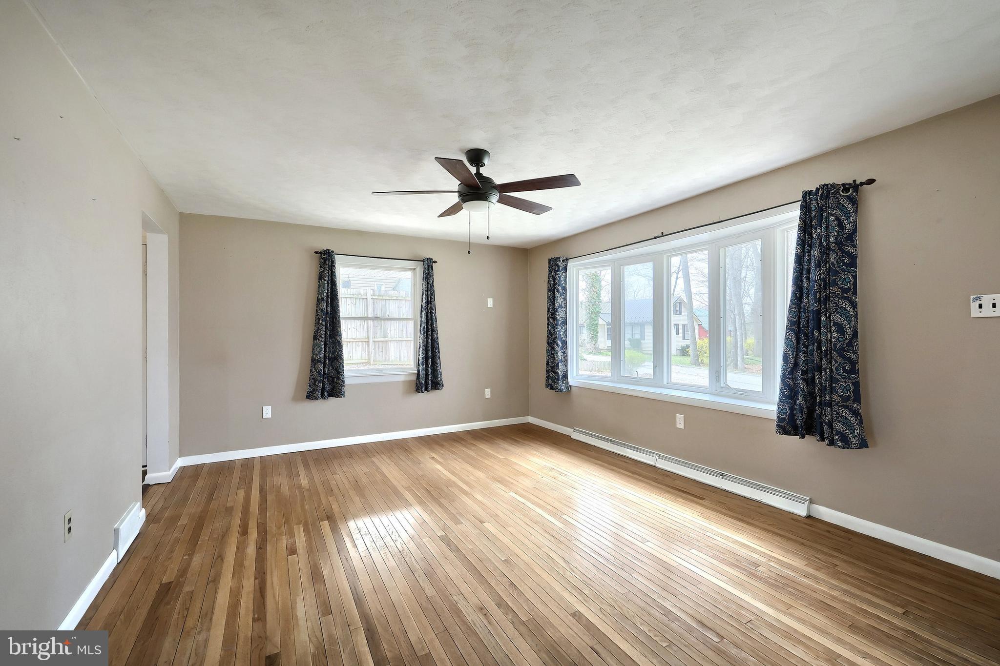 13 Circle Drive Jacobus, PA 17407 - Photo 5 of 53 a view of an empty room with a window and wooden floor